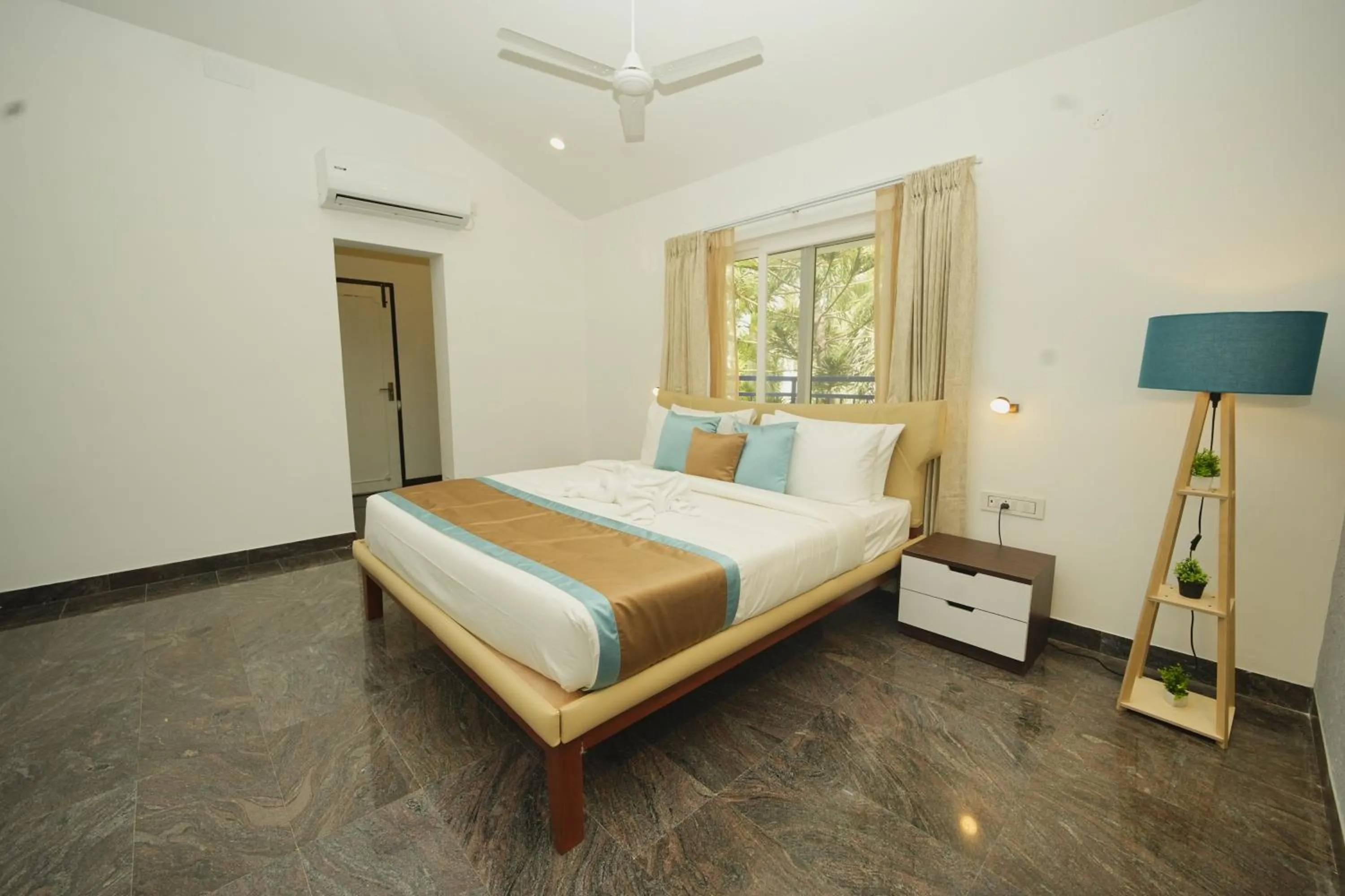 Bed in Bay Breeze Suites