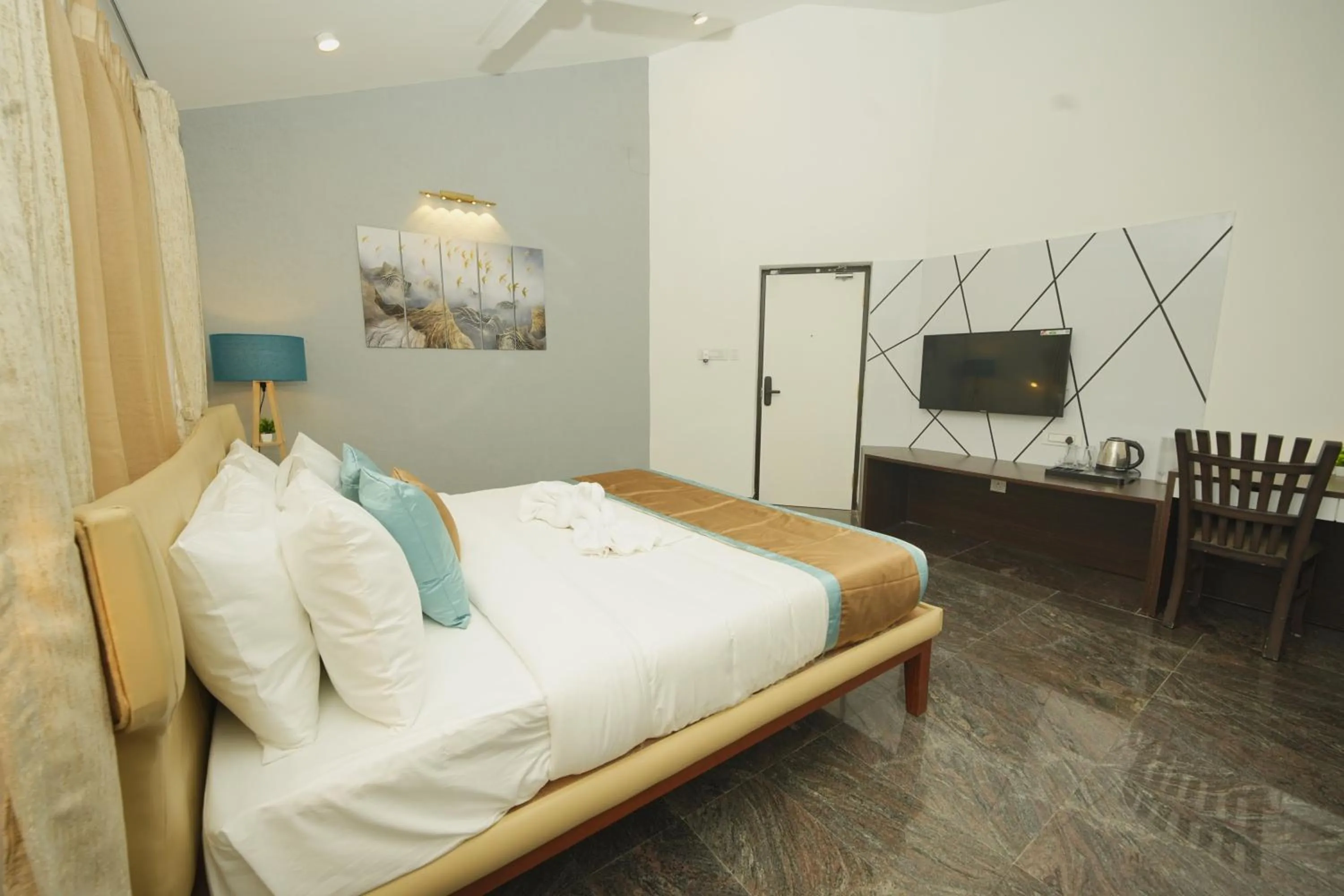 Bed in Bay Breeze Suites