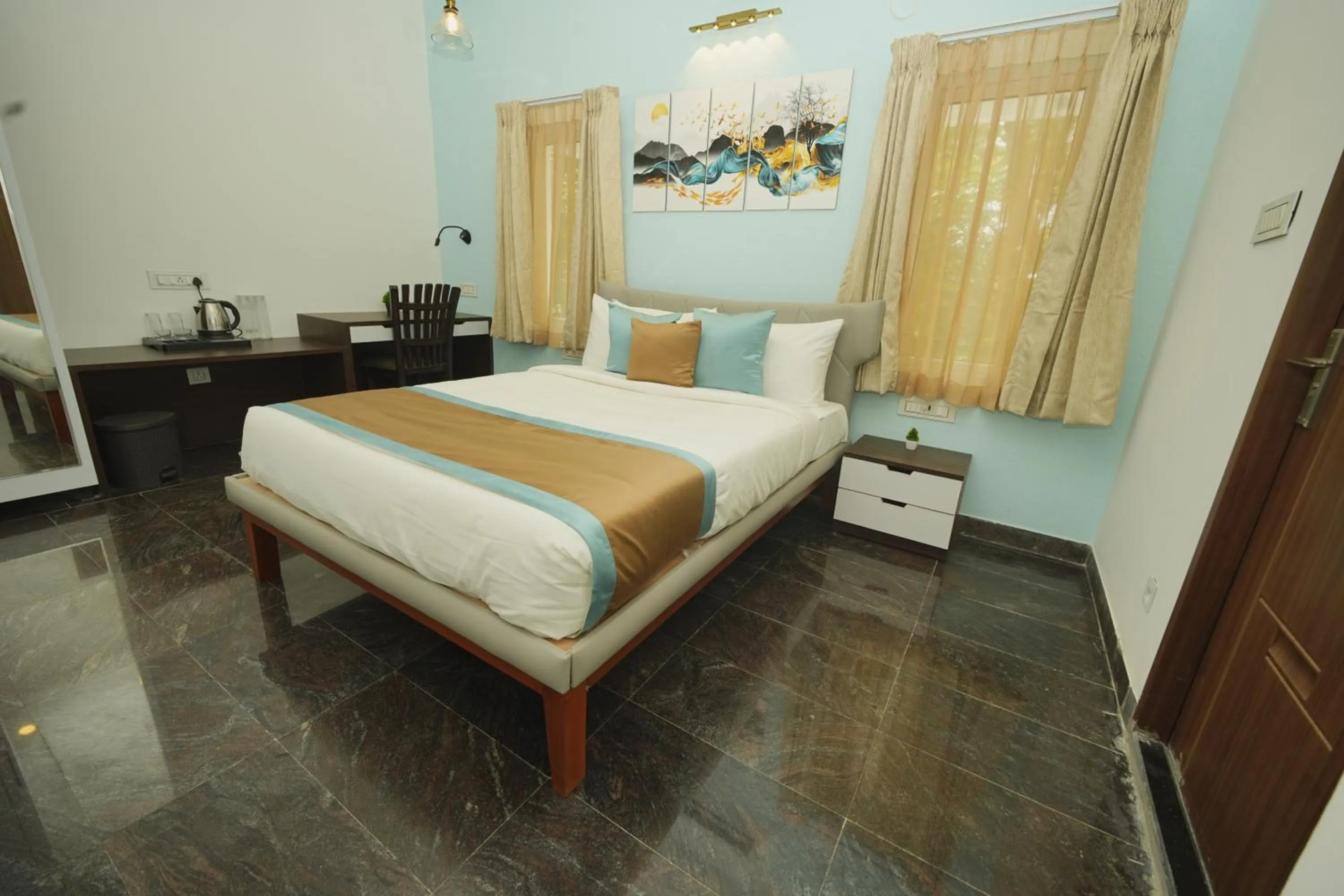 Bed in Bay Breeze Suites