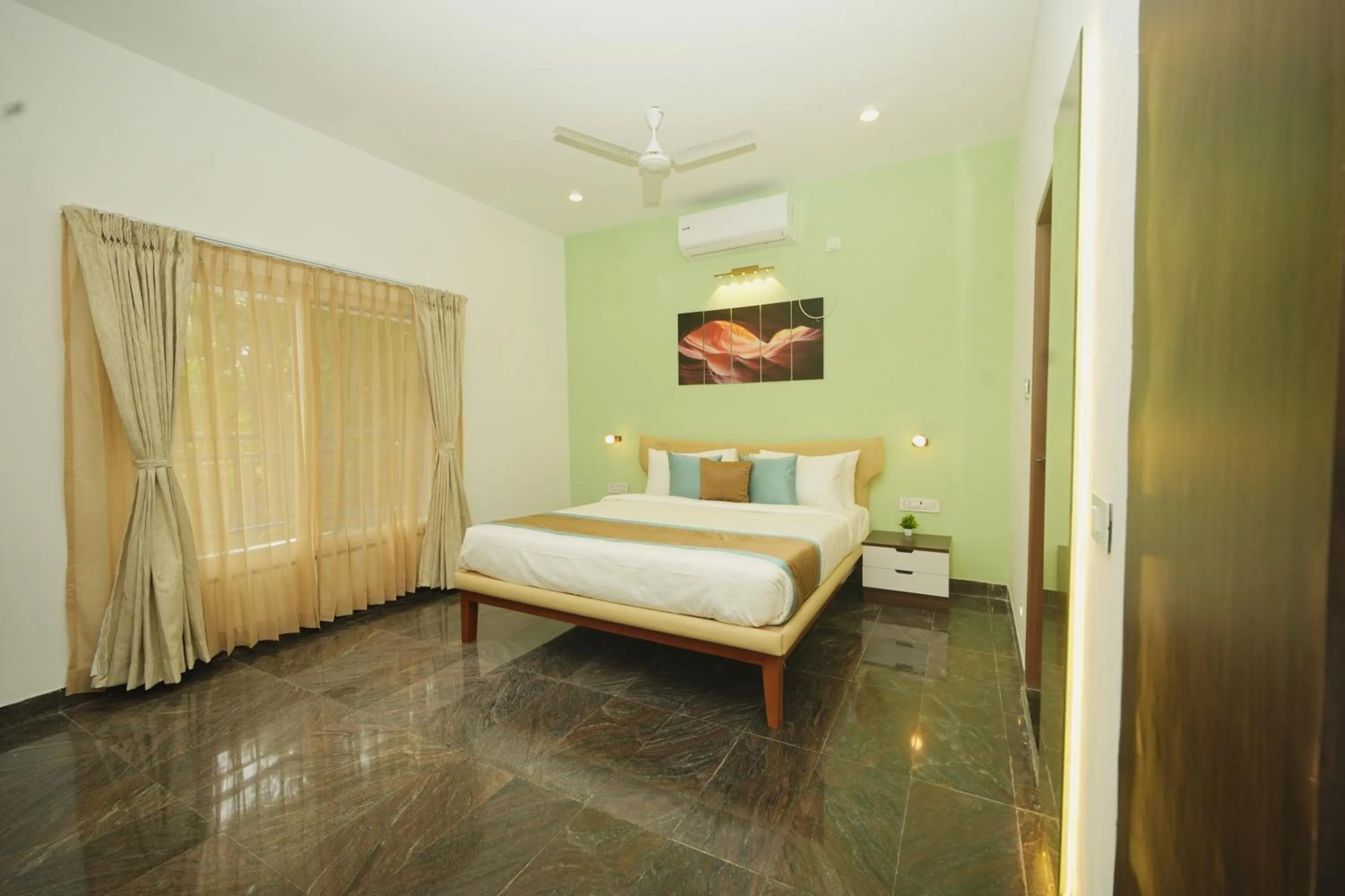 Bed in Bay Breeze Suites