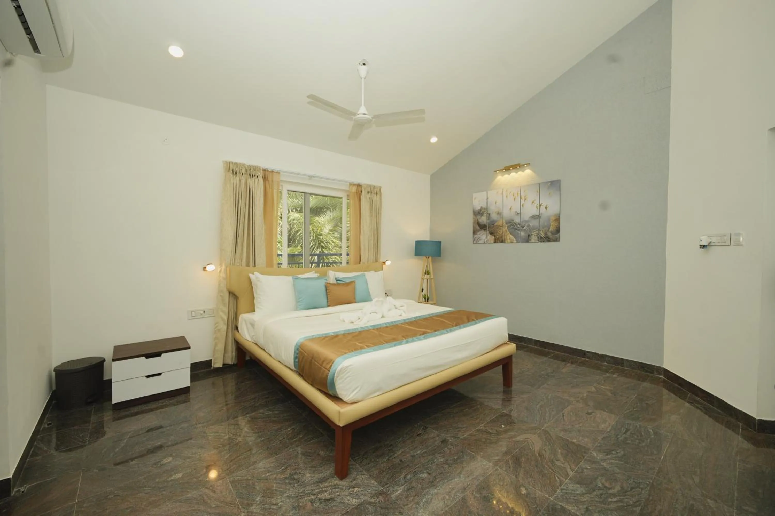 Bed in Bay Breeze Suites