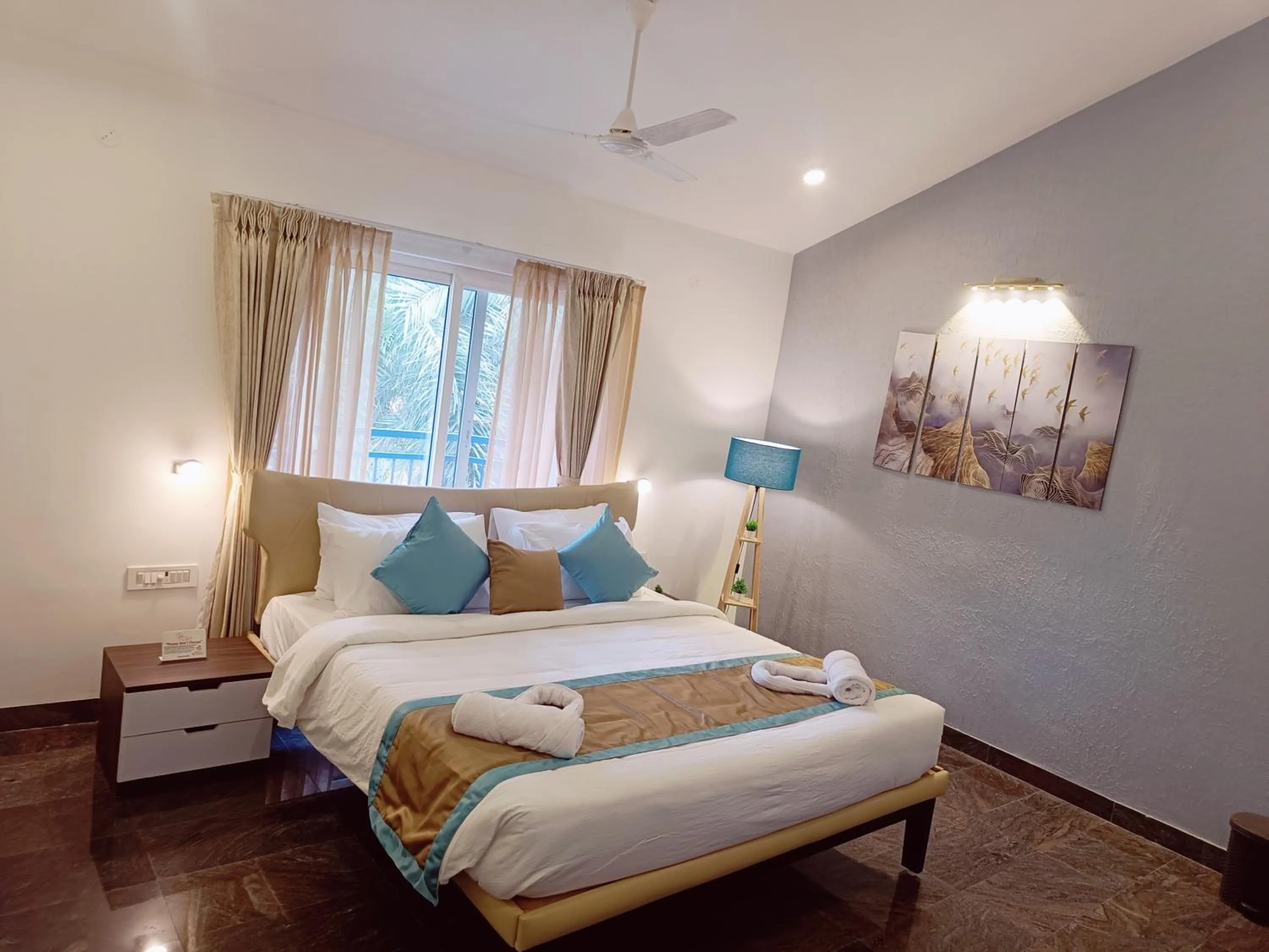 Bed in Bay Breeze Suites