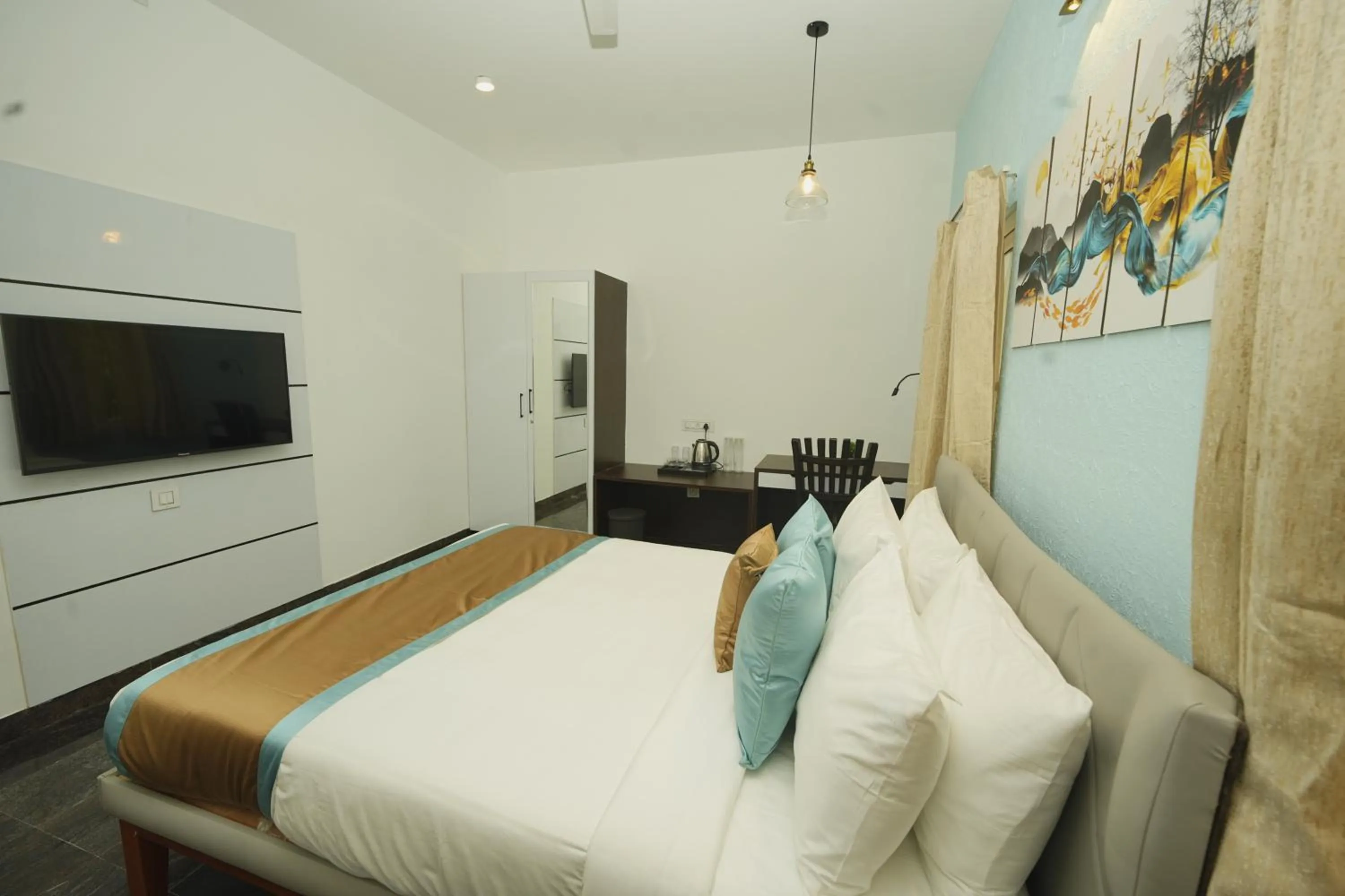 Bed in Bay Breeze Suites