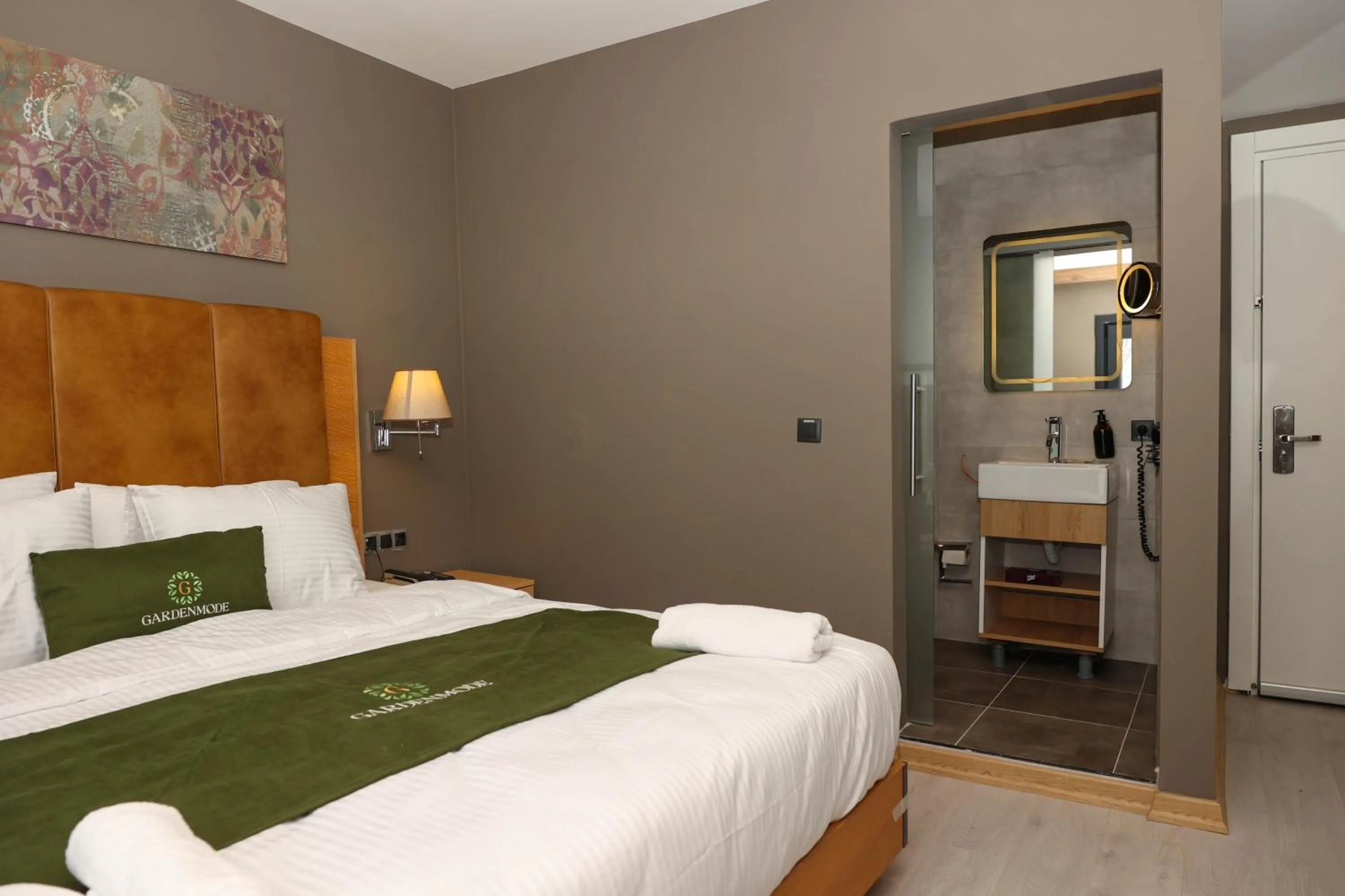 Bed in Gardenmode Airport Hotel