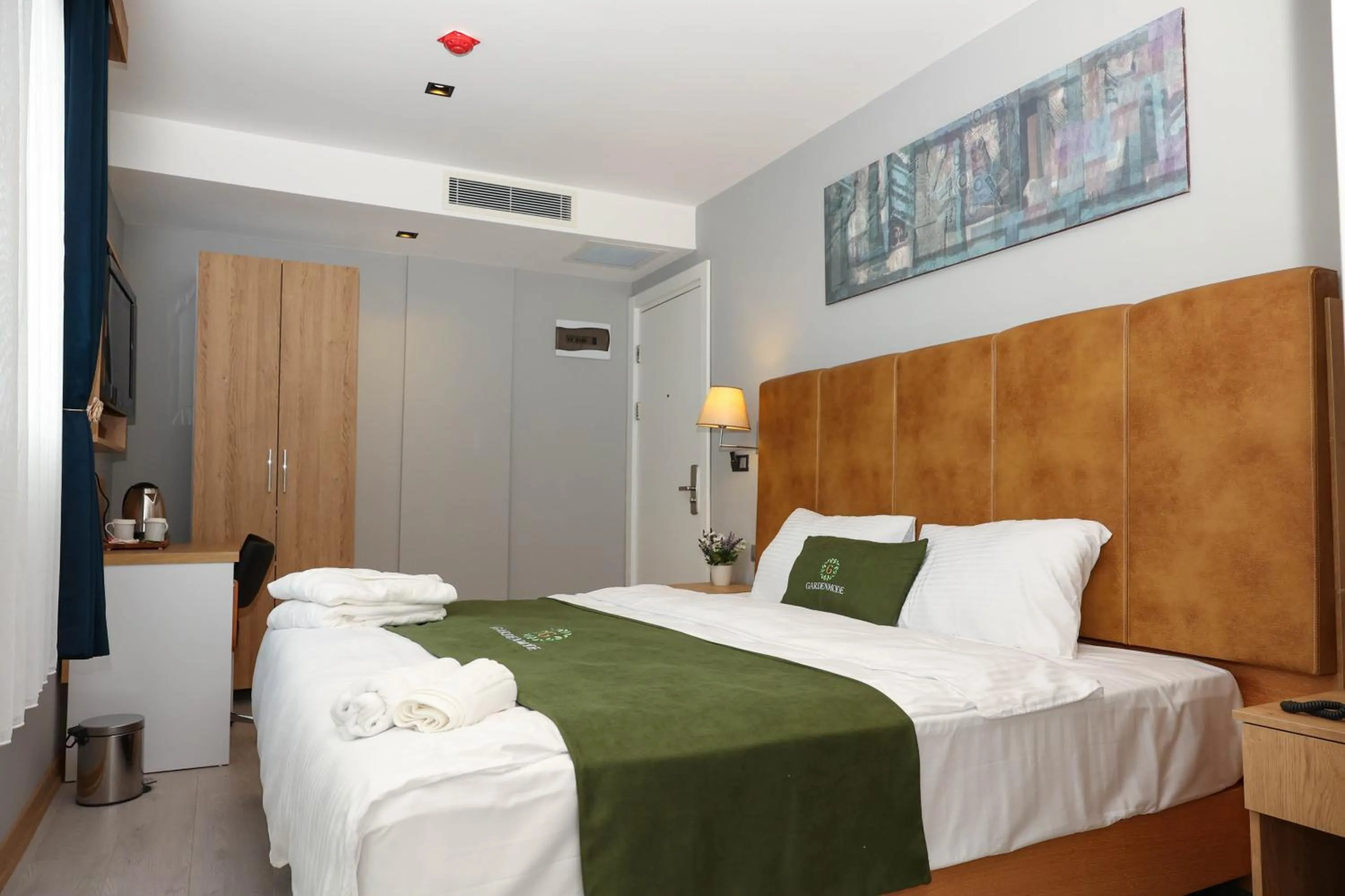 Bed in Gardenmode Airport Hotel