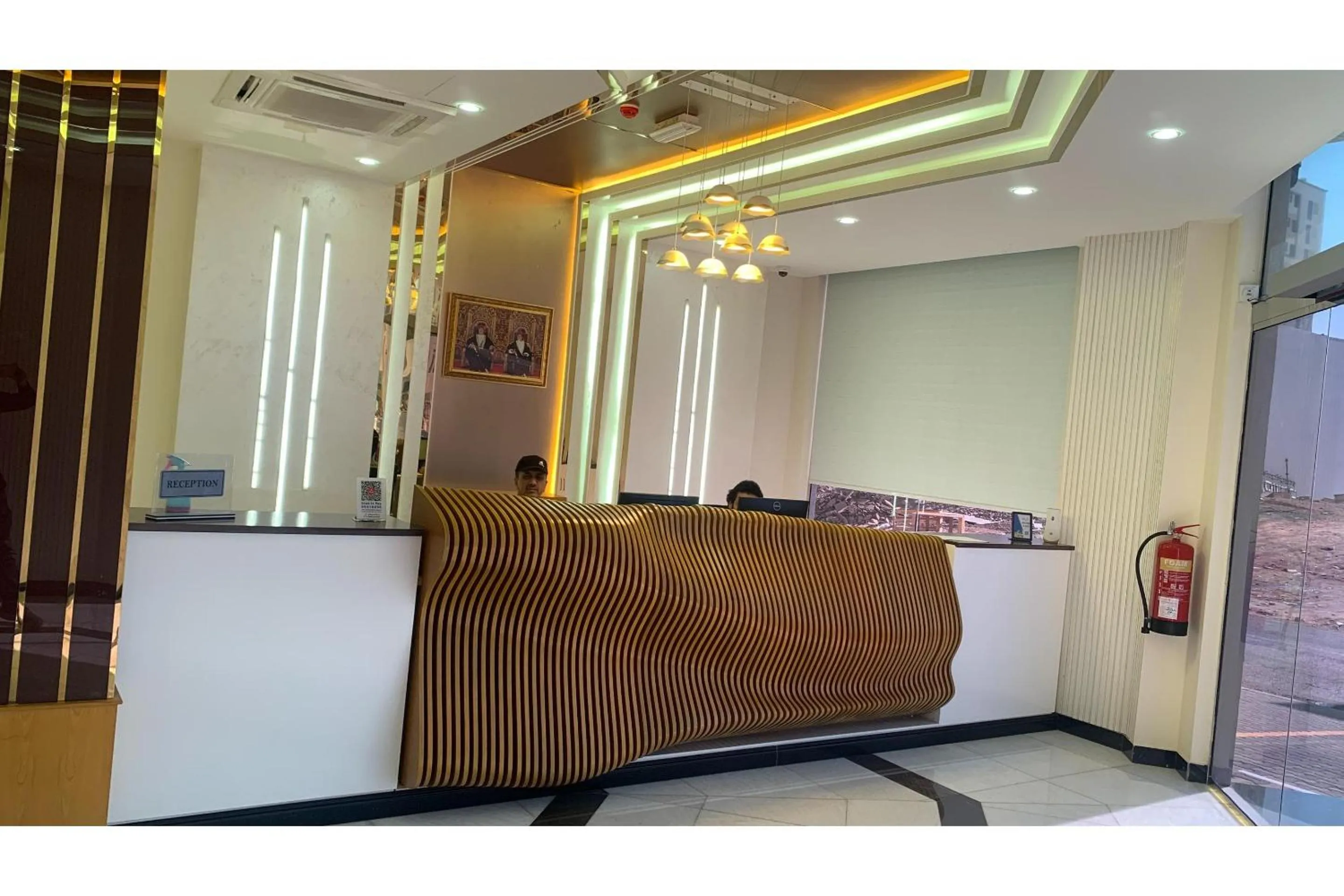 Lobby or reception in OYO Townhouse 156 Rose Hotel Apartments