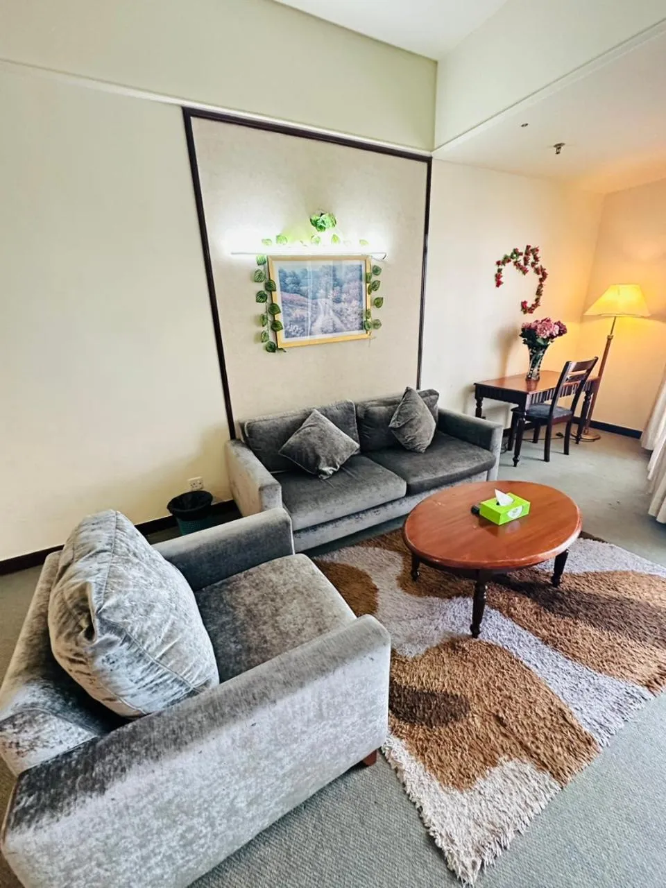 Seating area in KL COZY GOLD SUITE At TIMES SQUARE