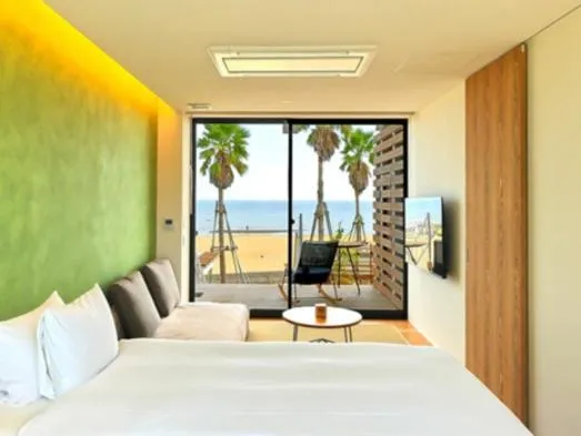 Bed in そらすな Beach Side Resort Hotel