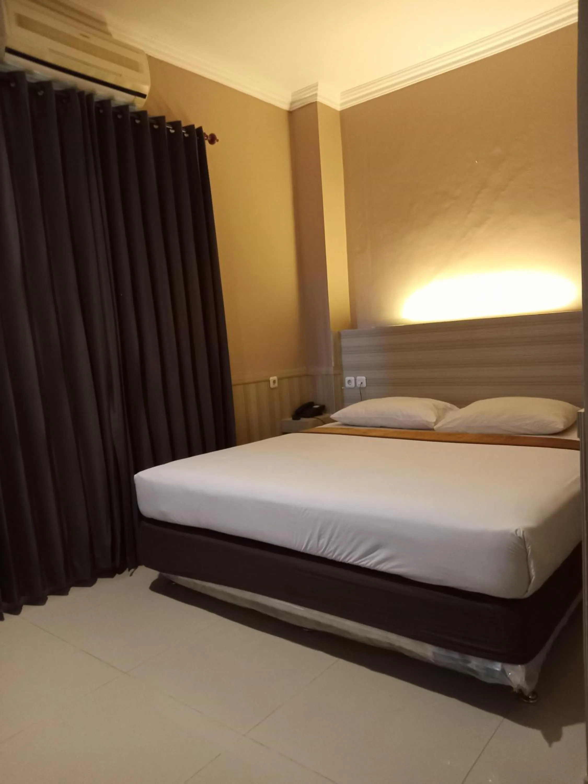 Bed in Violand Garden Hotel Samarinda