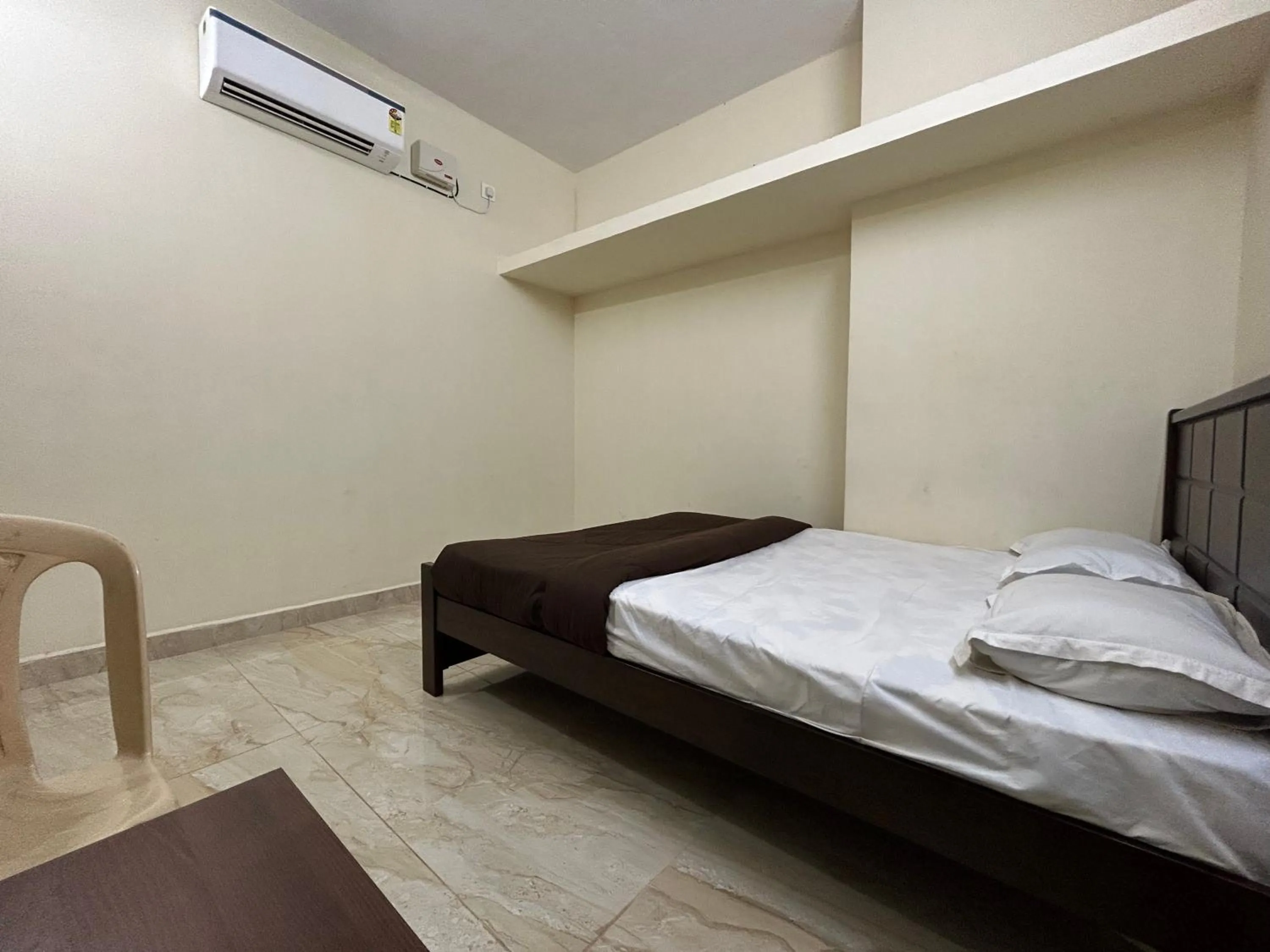 Bed in The kaya homestay Srirangam