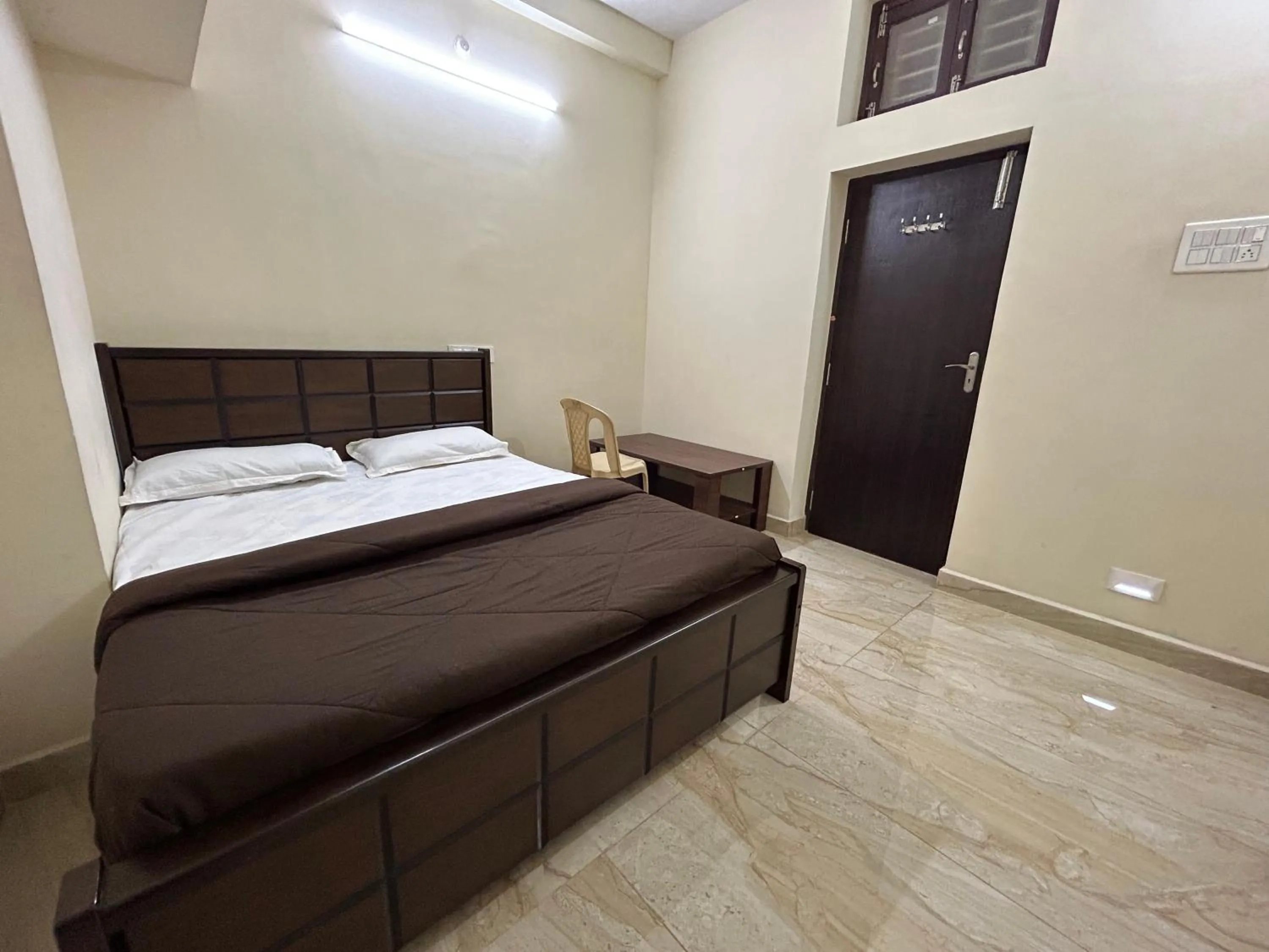 Bed in The kaya homestay Srirangam