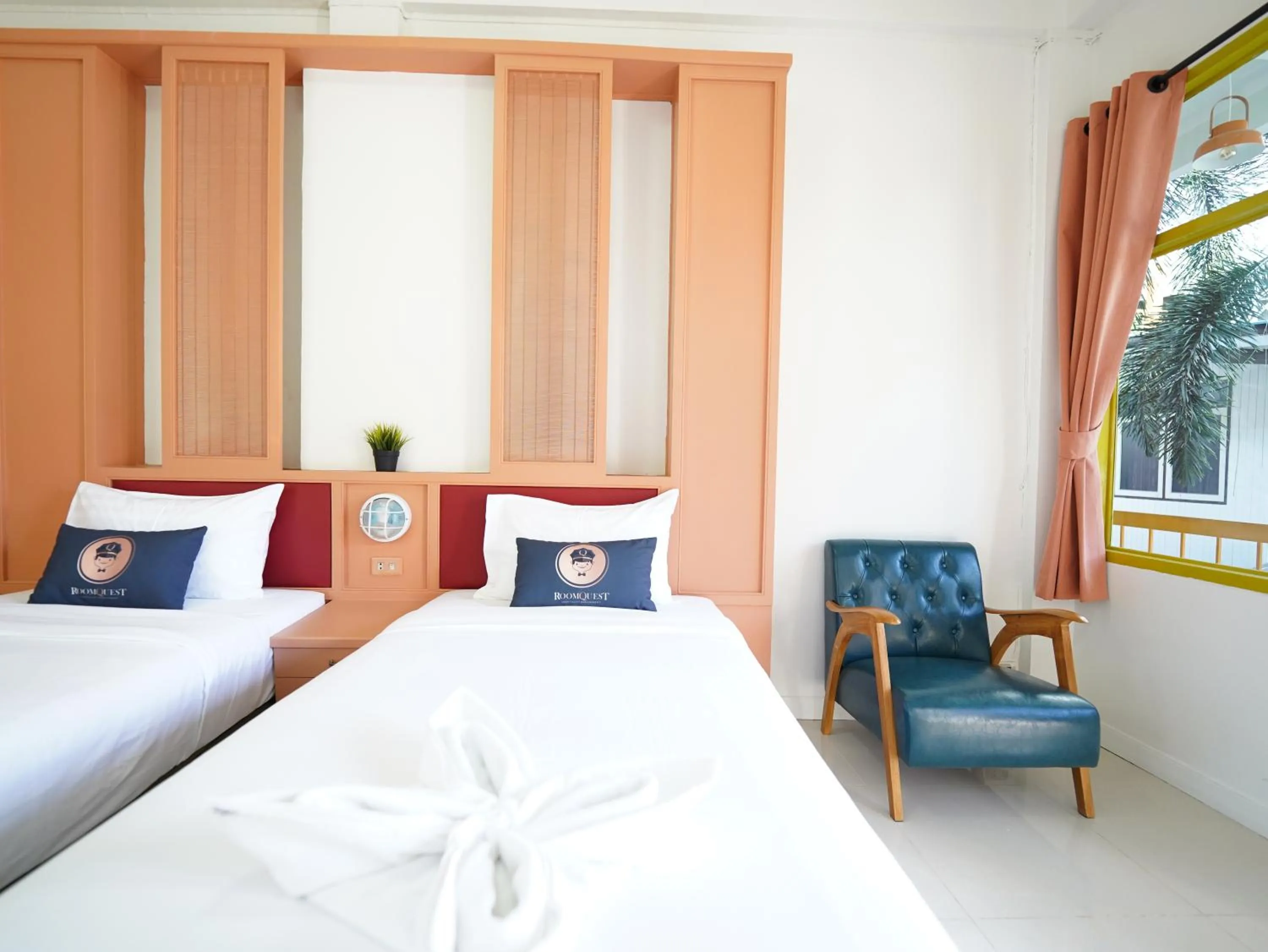 Bed in RoomQuest Hotel Pratunam