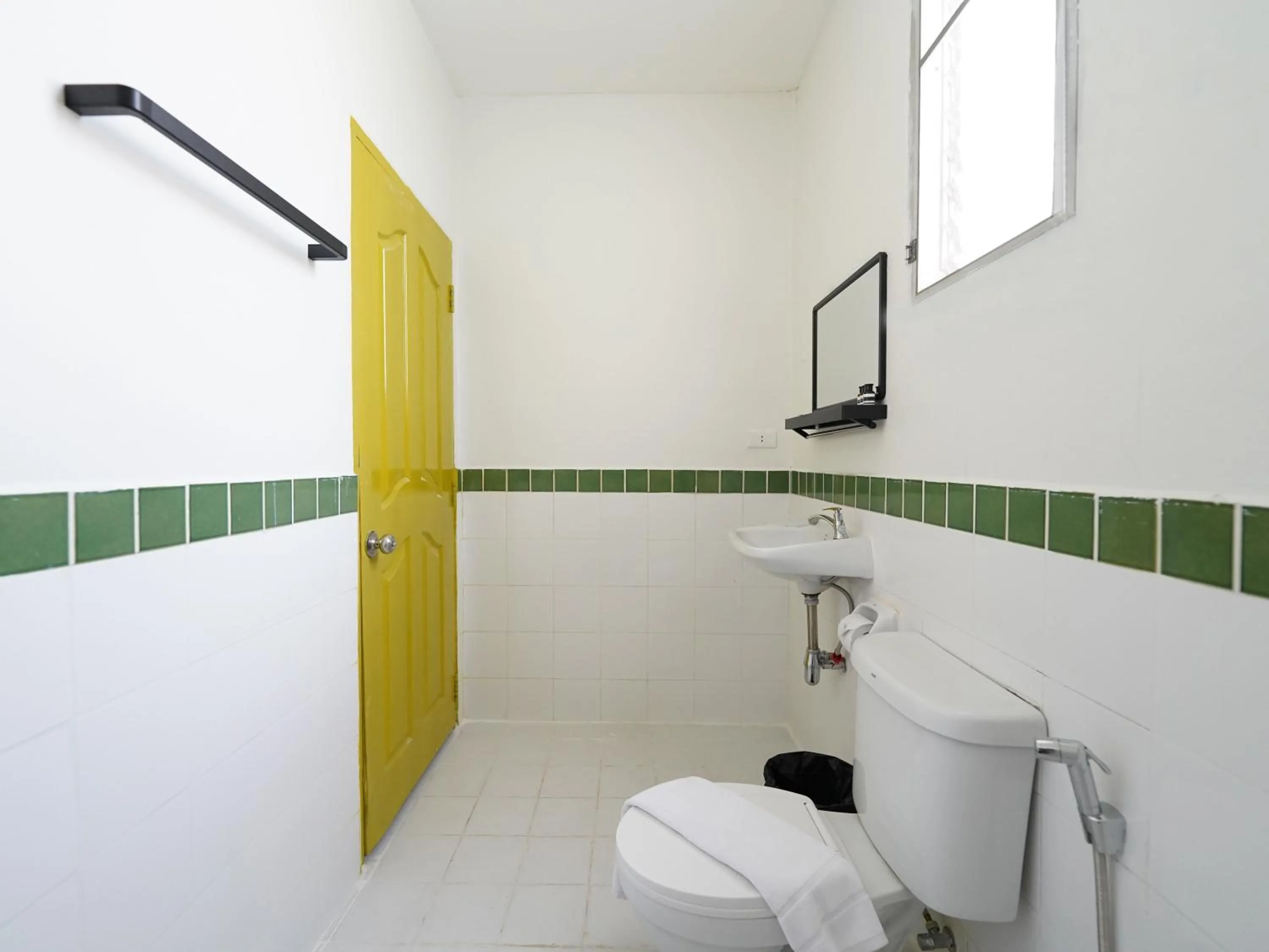 Bathroom in RoomQuest Hotel Pratunam