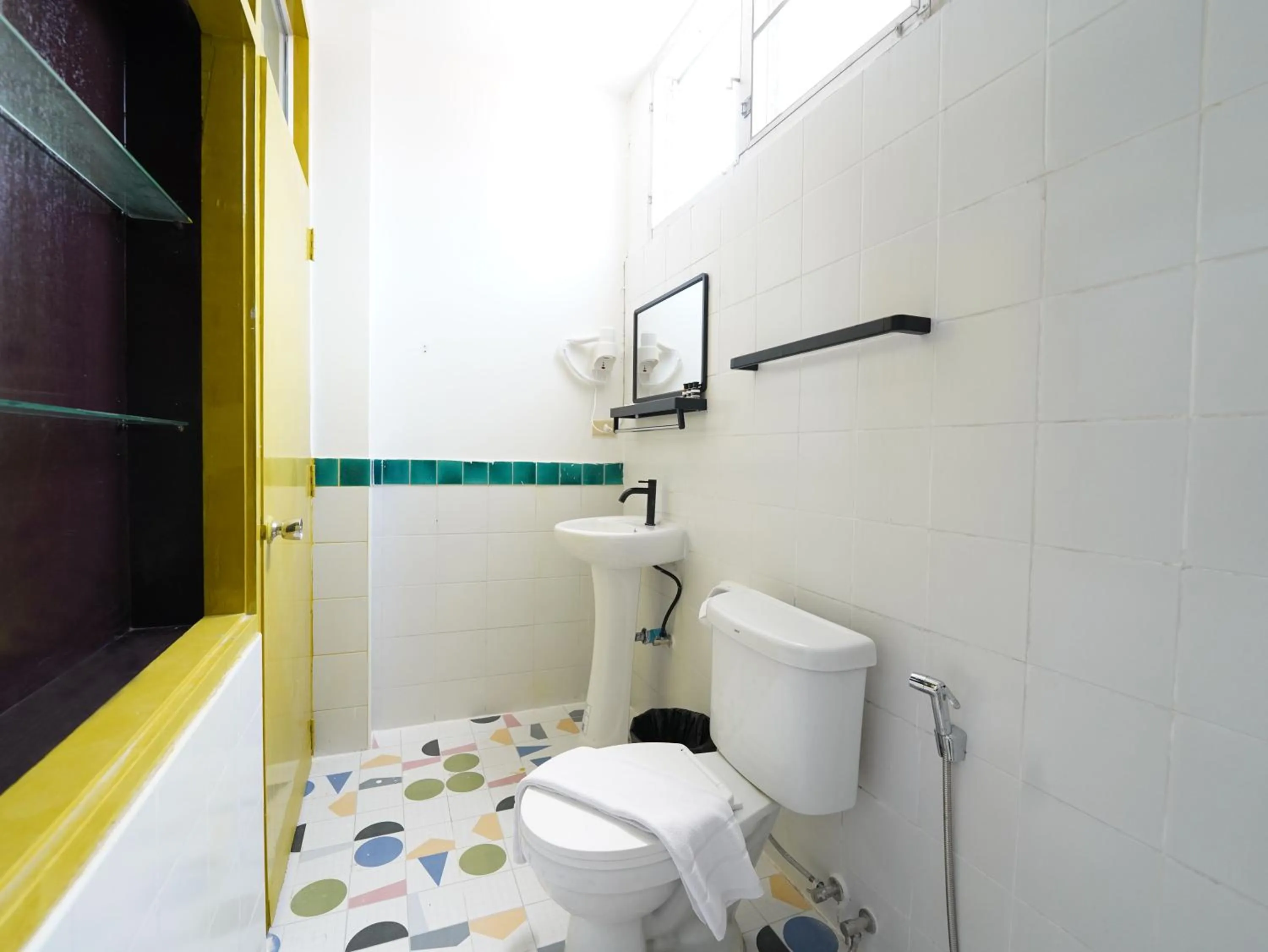 Bathroom in RoomQuest Hotel Pratunam