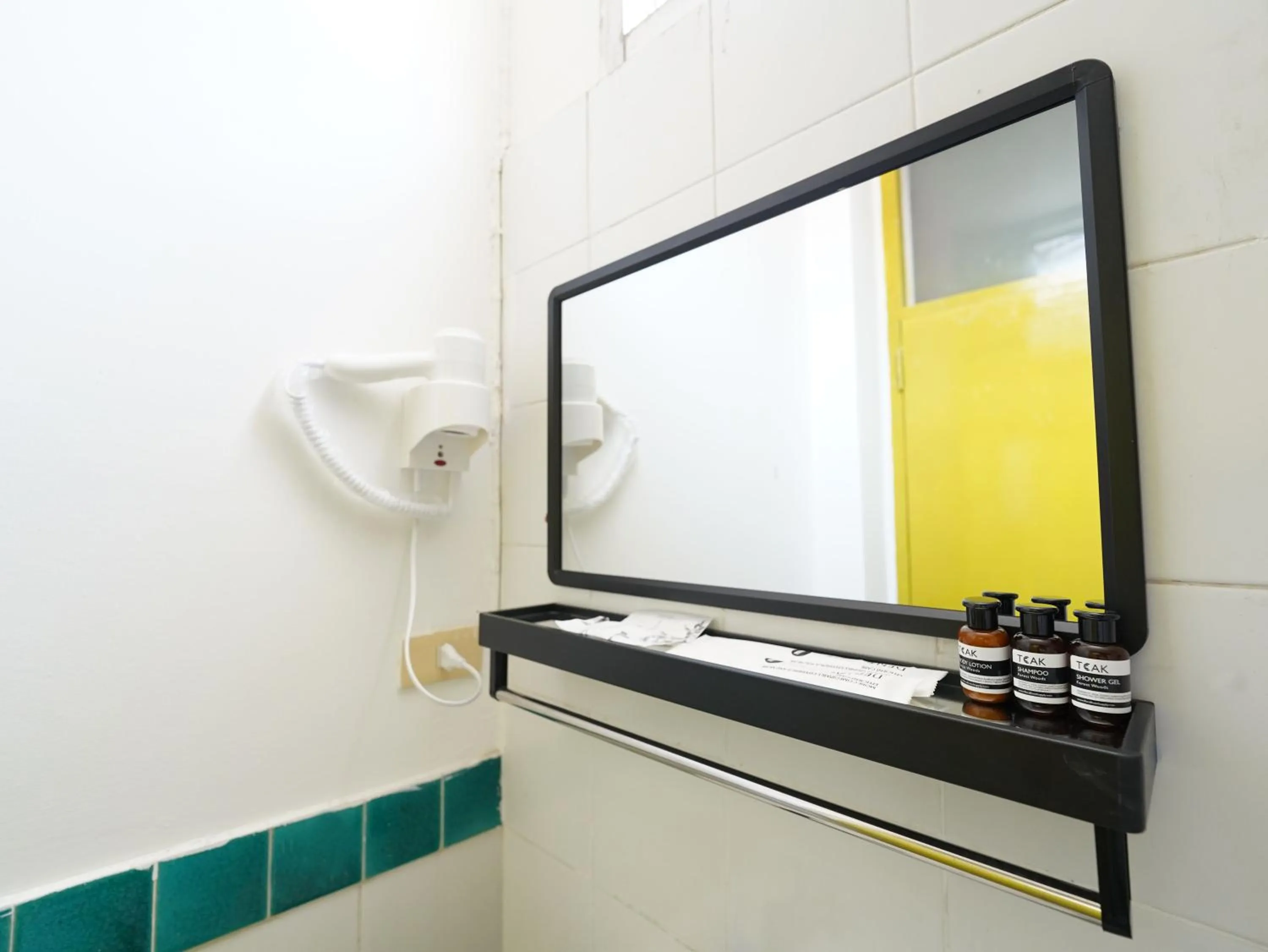 Bathroom in RoomQuest Hotel Pratunam