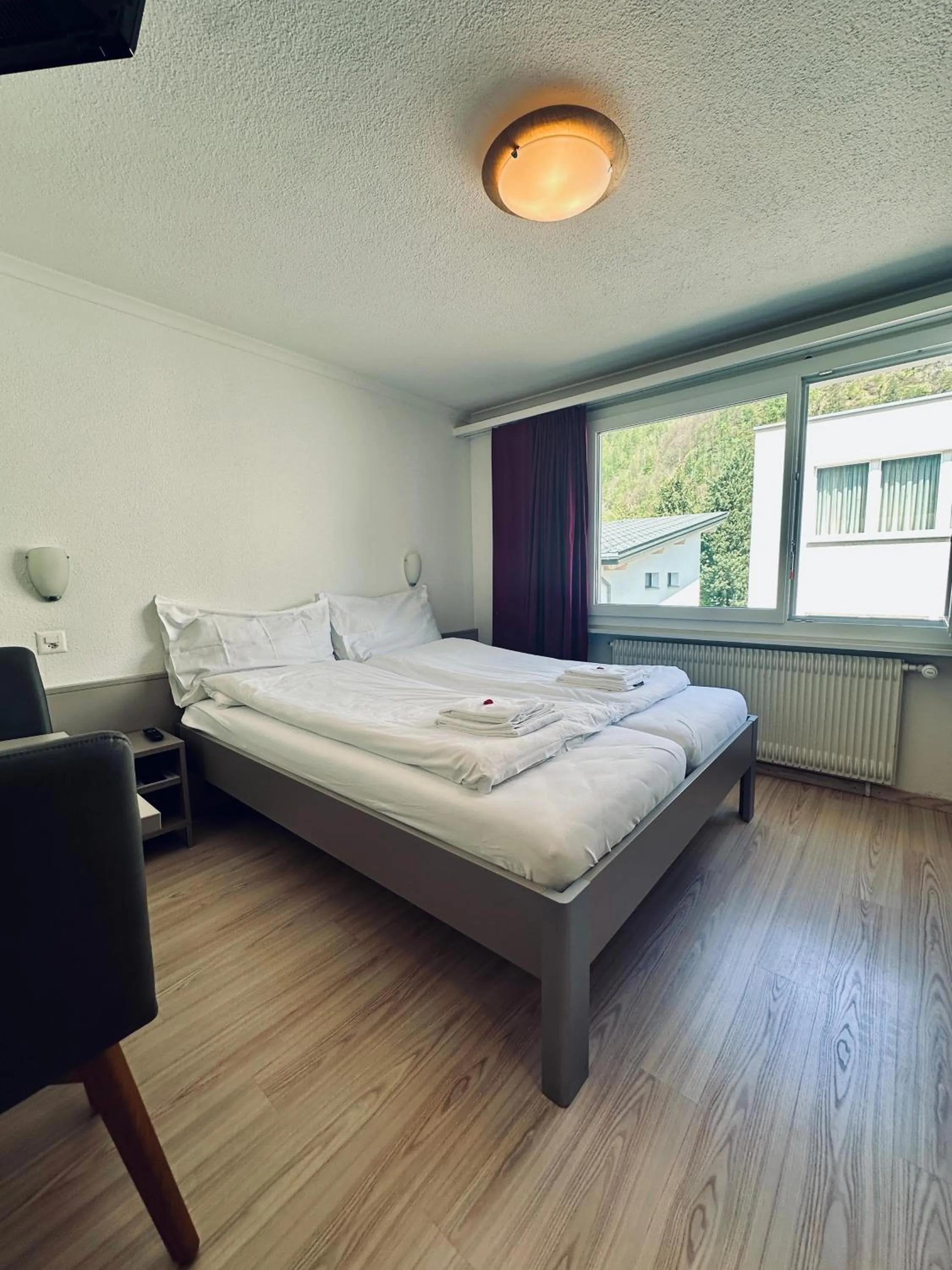 Bed in Hotel Rebstock Meiringen