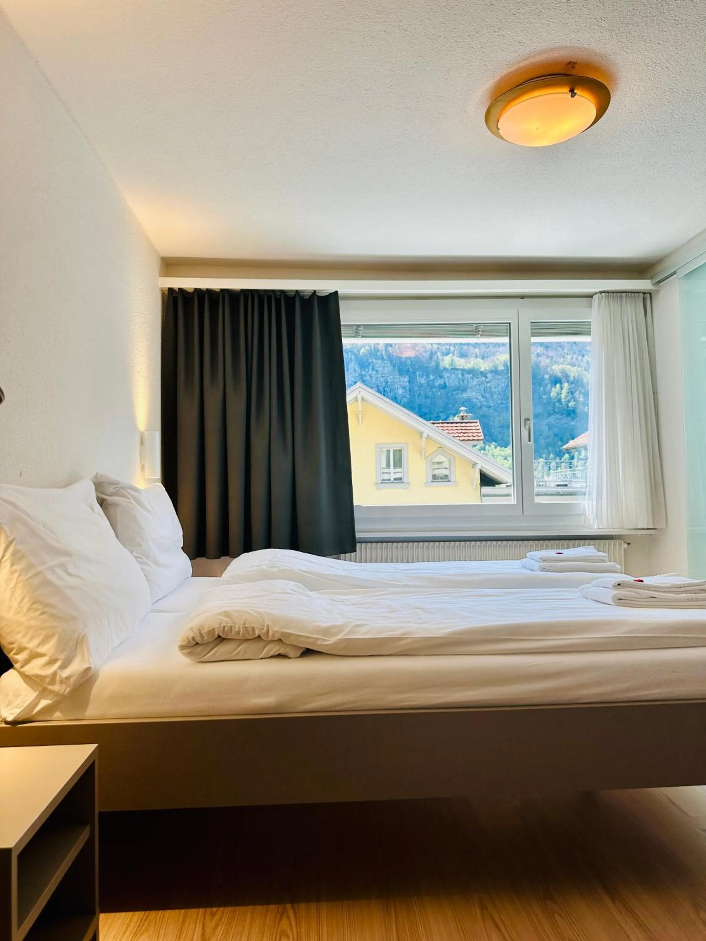 Bed in Hotel Rebstock Meiringen