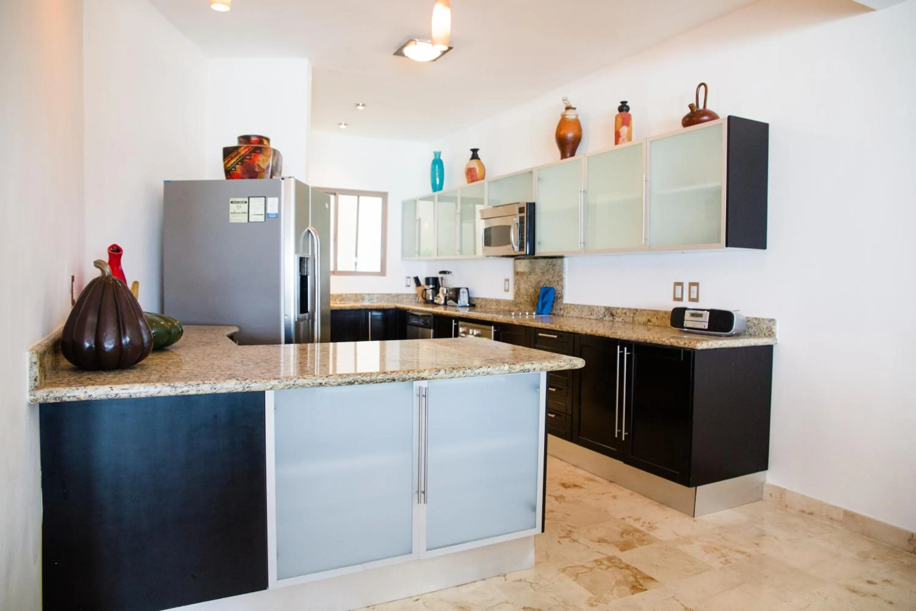 Kitchen or kitchenette in Ocean Front Corto Maltes 104 in Downtown