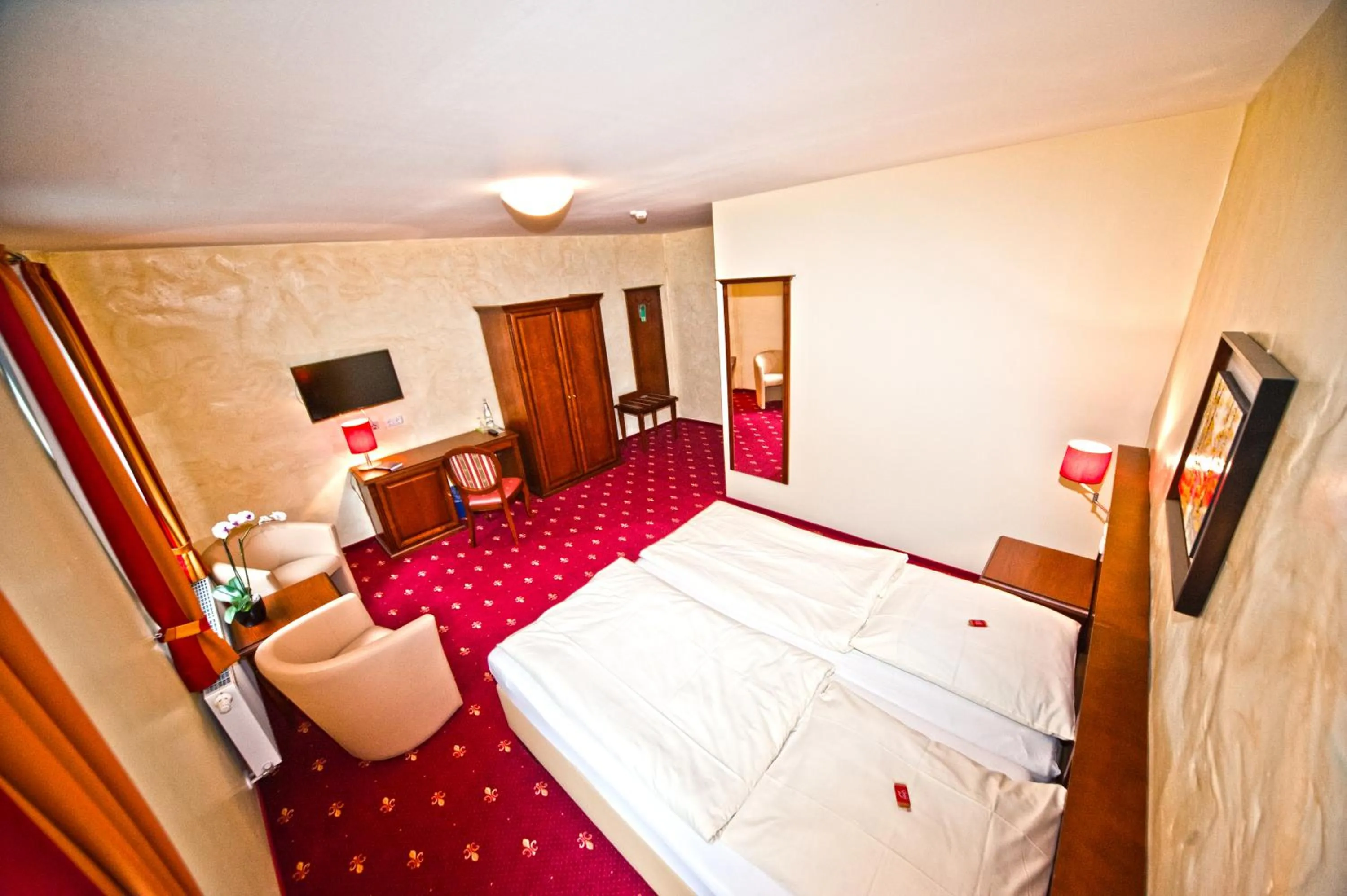 Seating area, Bed in Hotel Medaillon