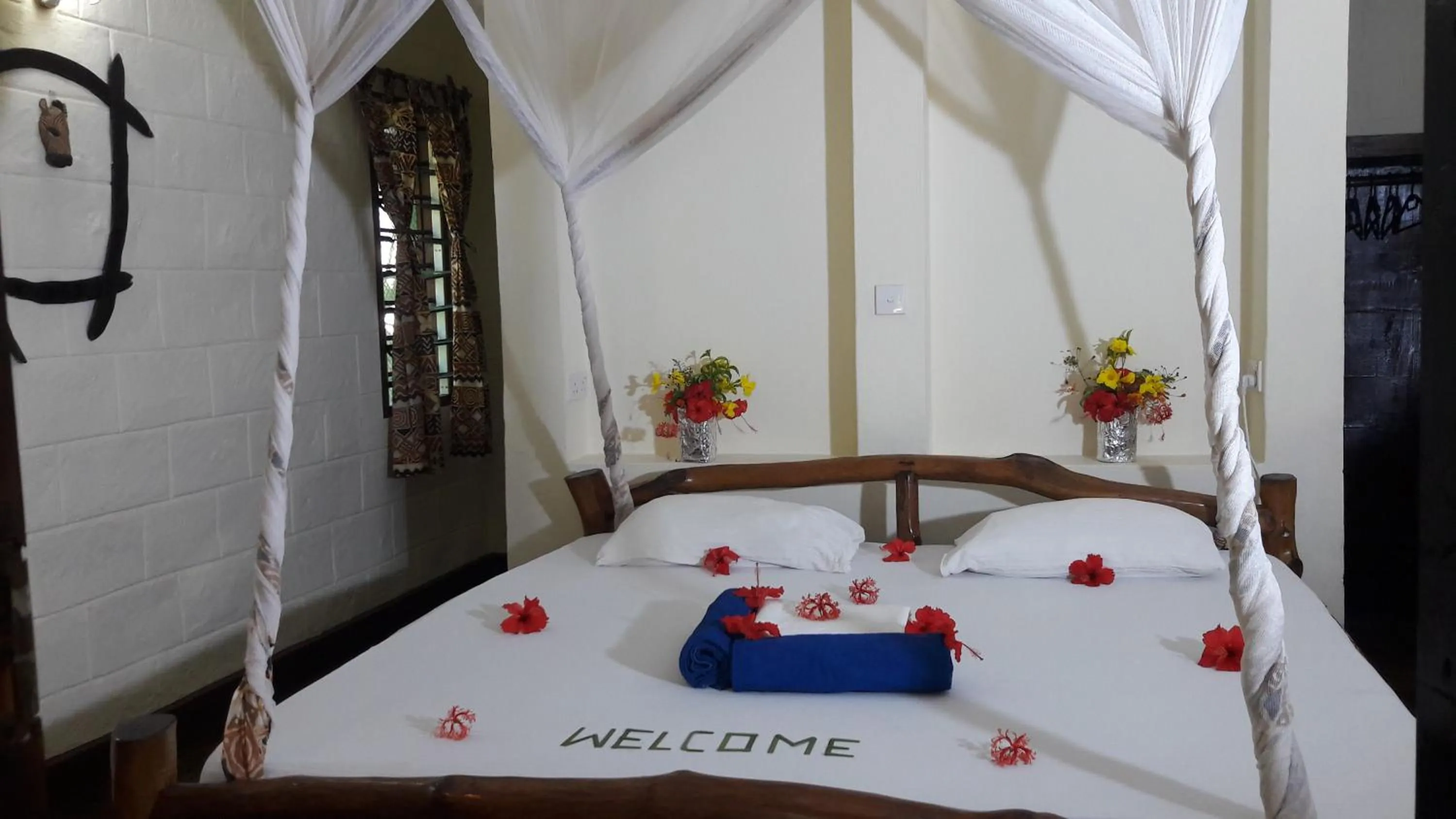 Bathroom, Bed in African Dream Cottages - Diani Beach