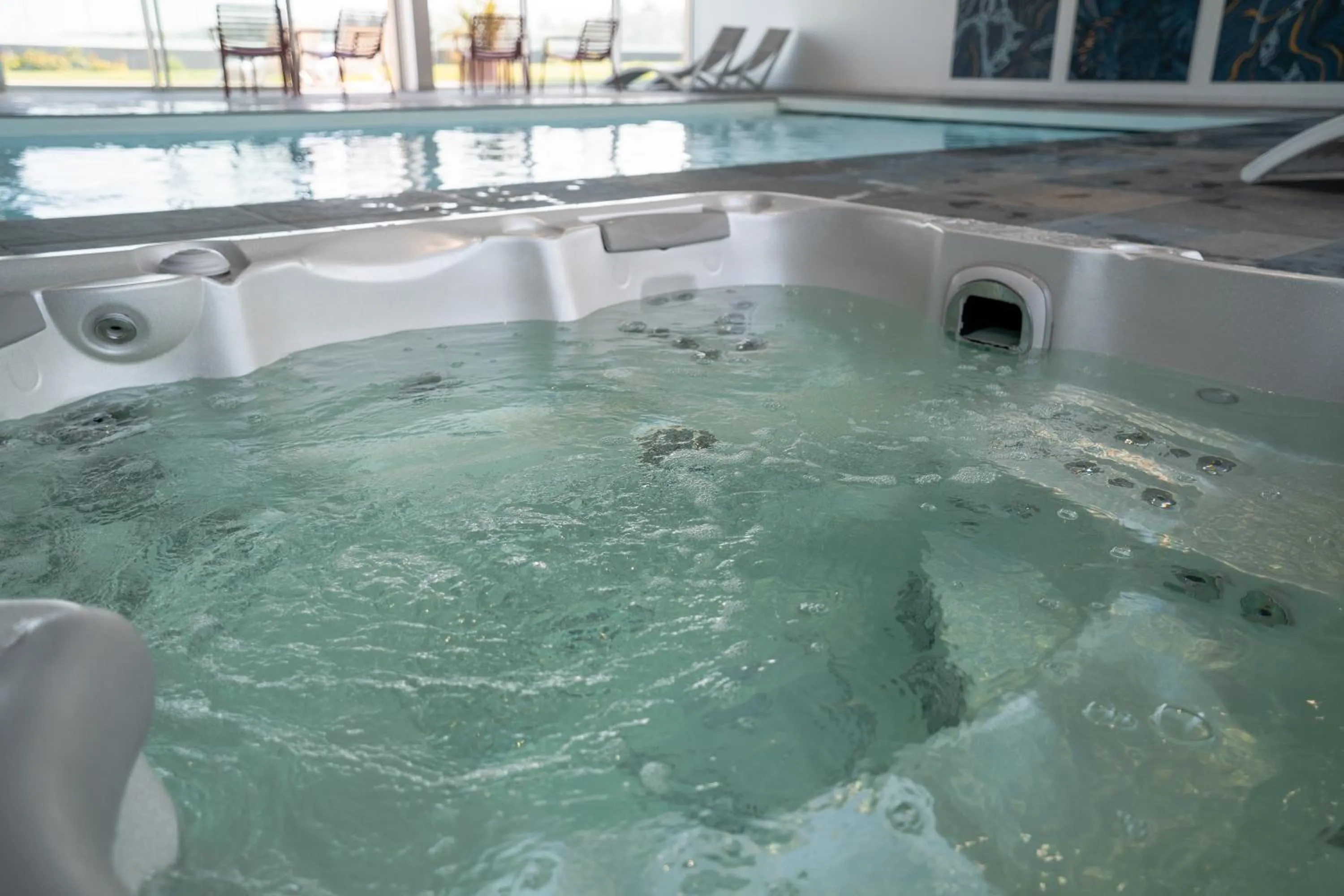 Swimming pool in Hôtel Le Manoir du Roselier
