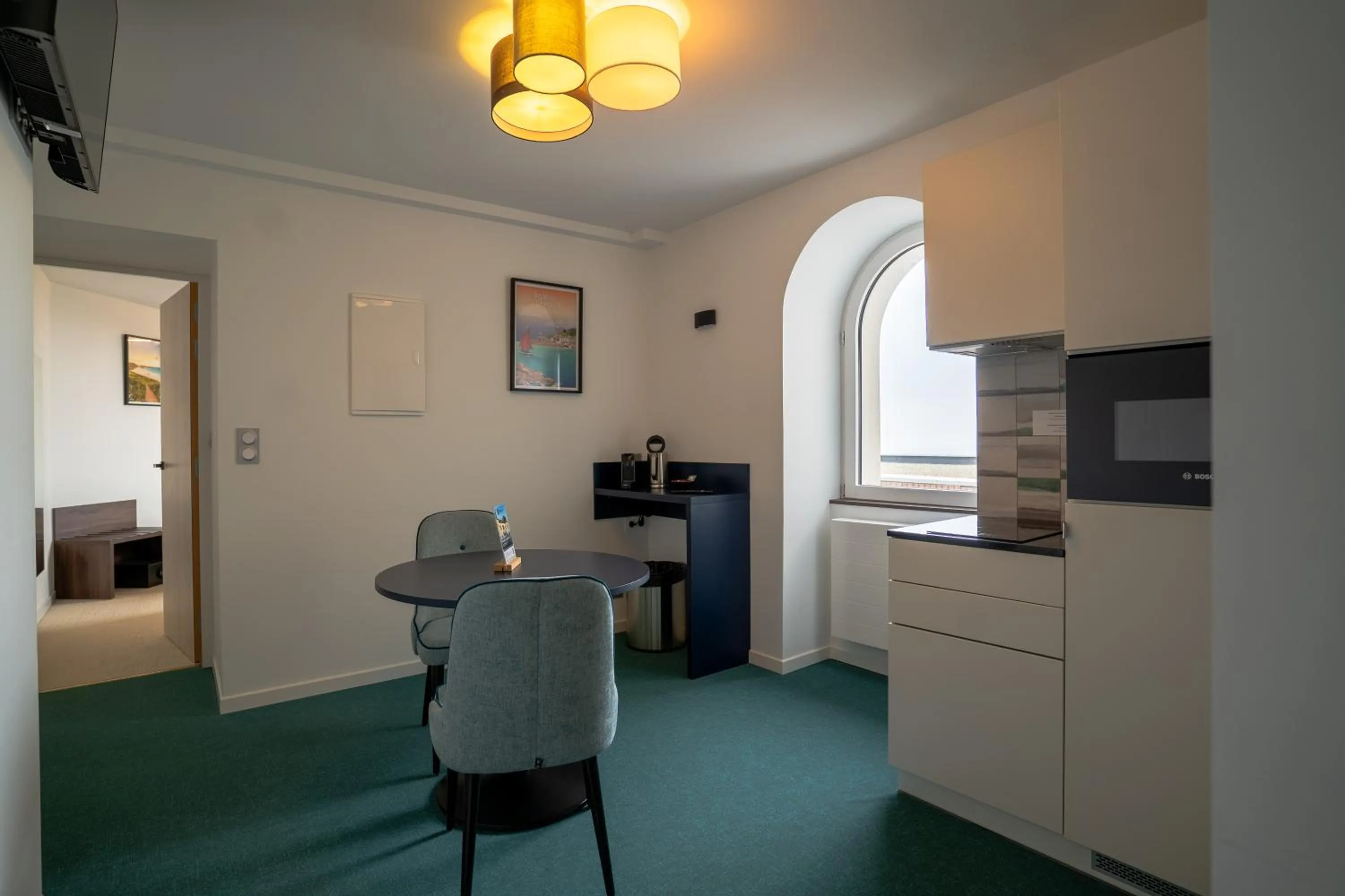 Kitchen or kitchenette in Hôtel Le Manoir du Roselier