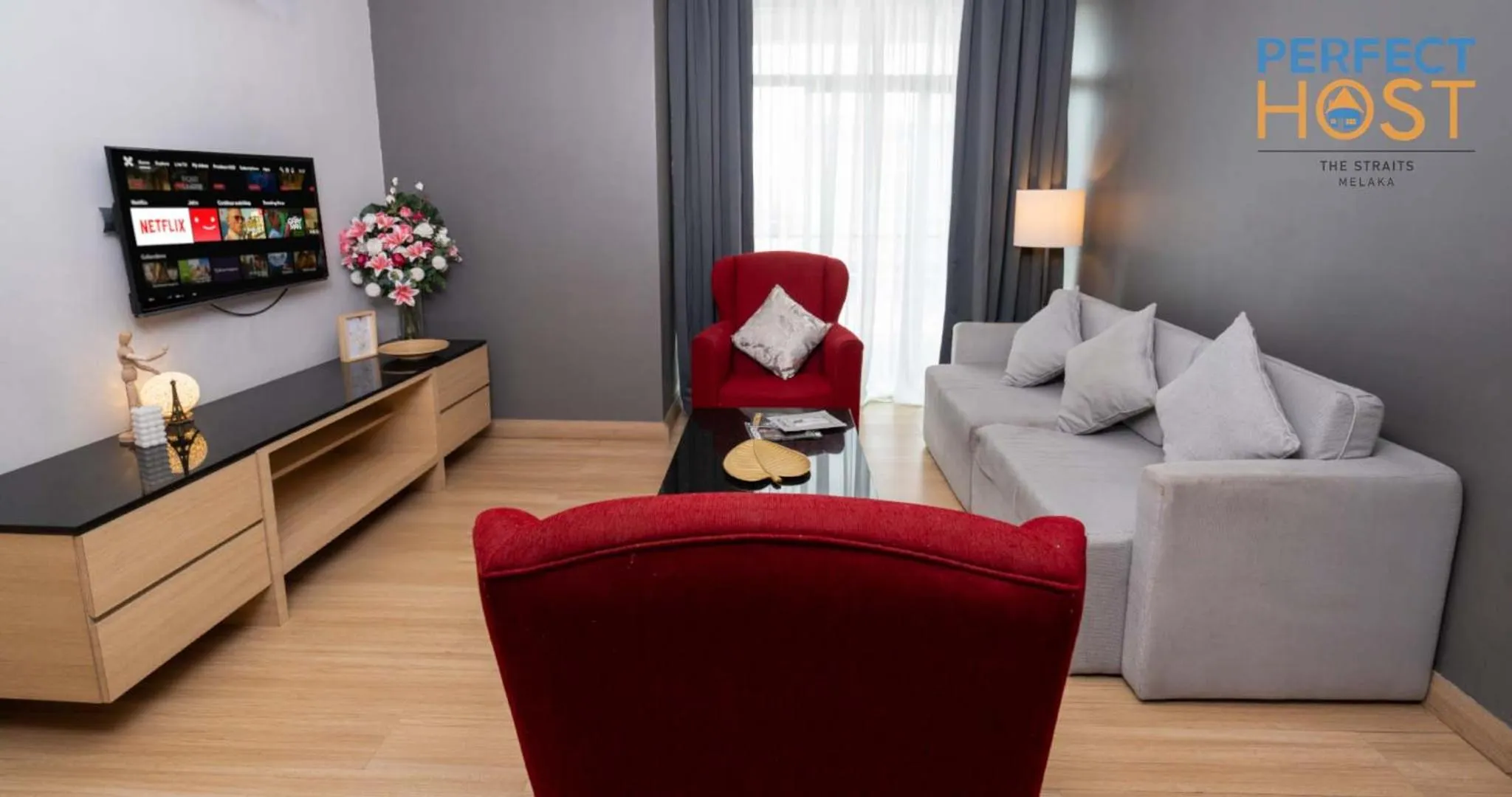 Communal lounge/ TV room in The Straits Melaka by Perfect Host