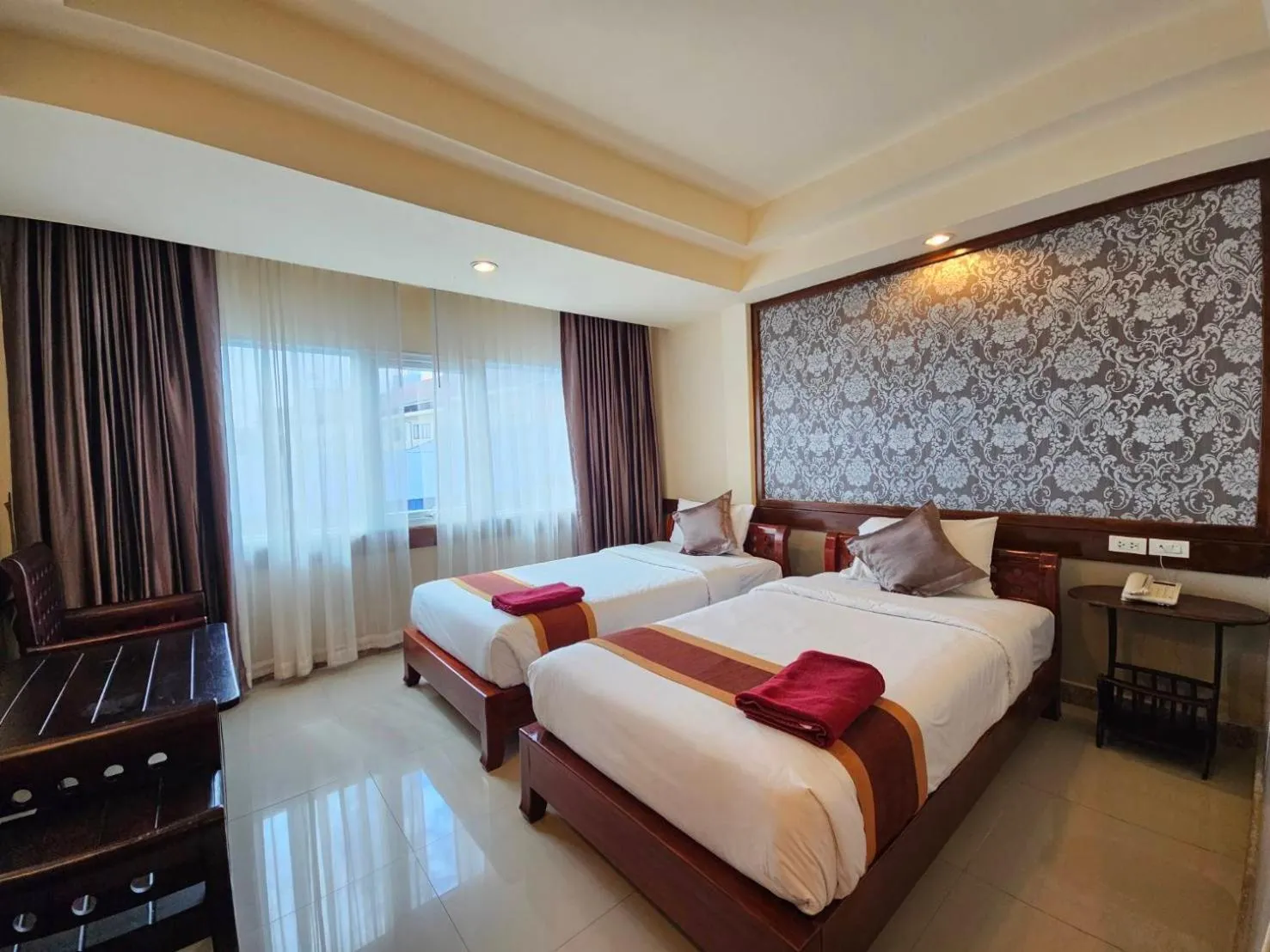 Bed in Boutique Bravo Hotel