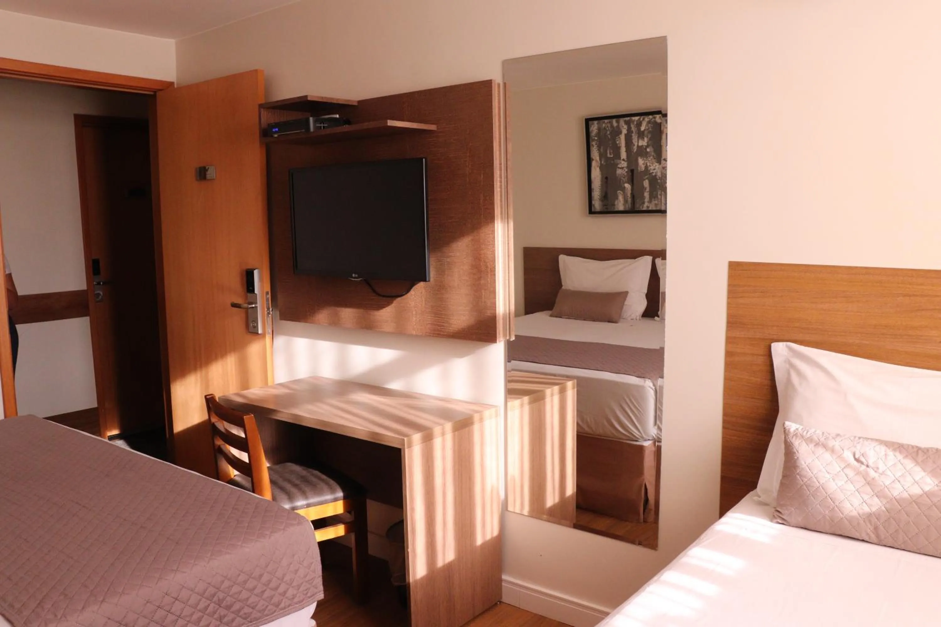 Bed in Vida Plaza Hotel