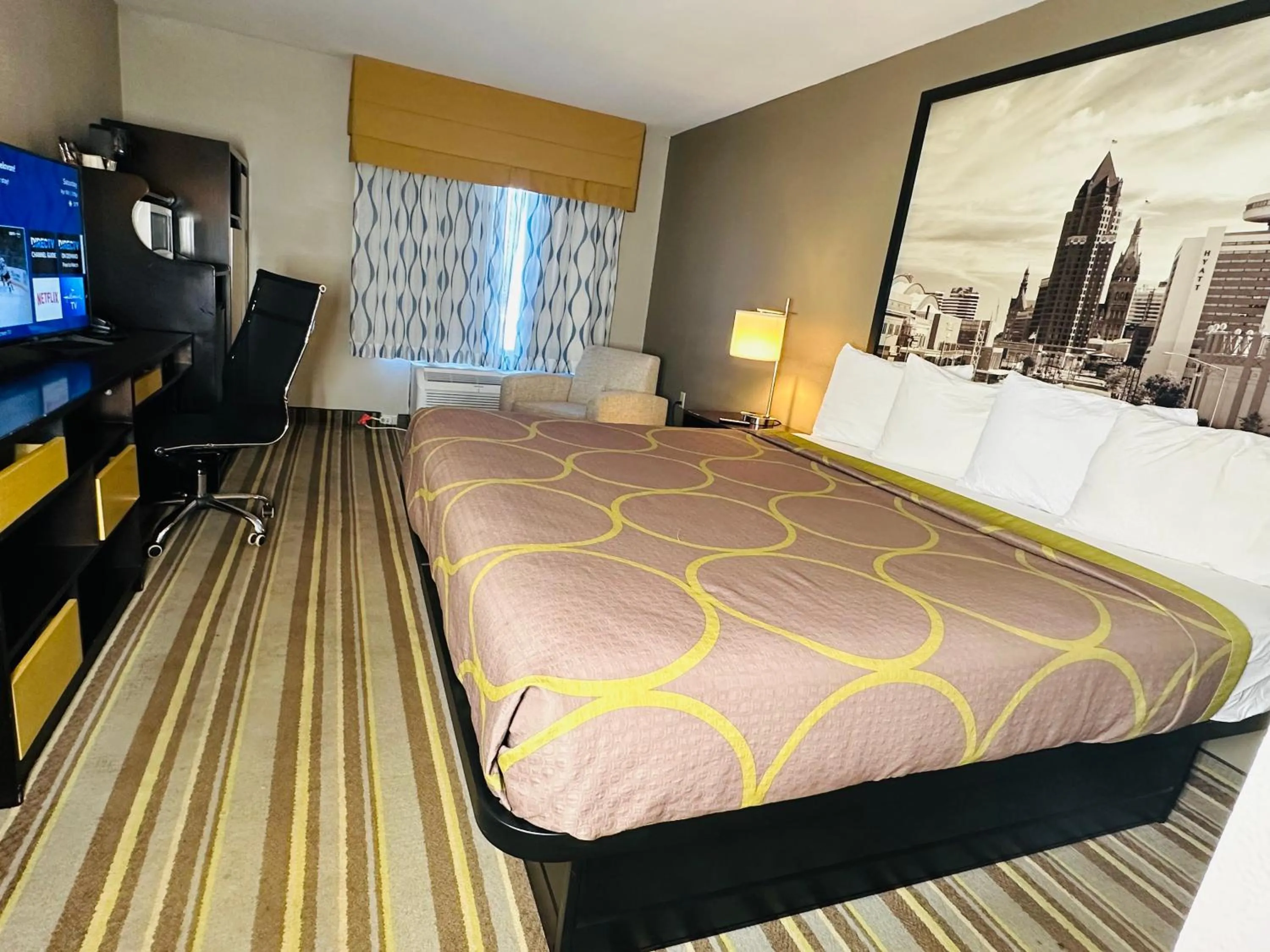 Bed in Delavan Inn and Suites