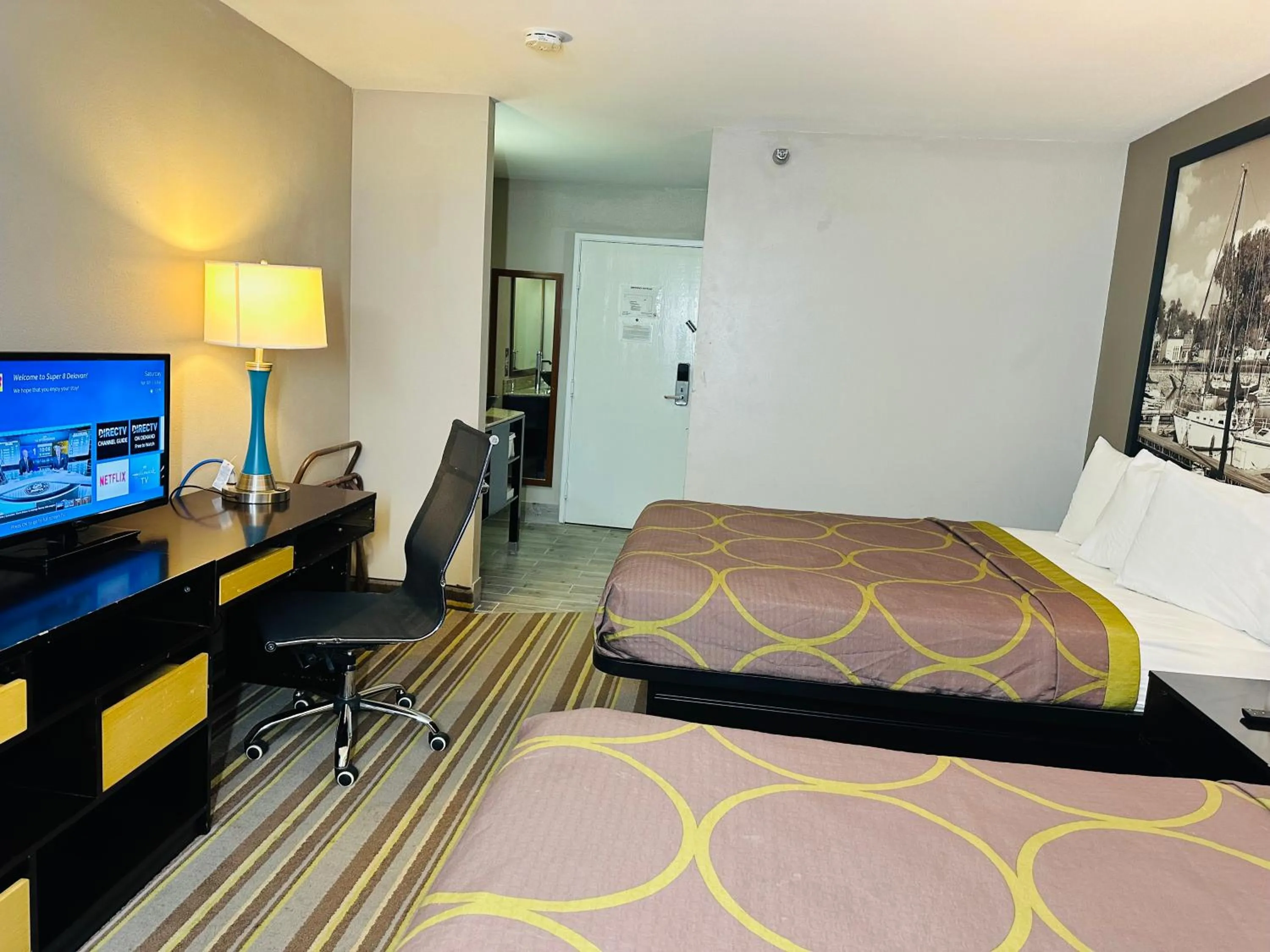 Bed in Delavan Inn and Suites