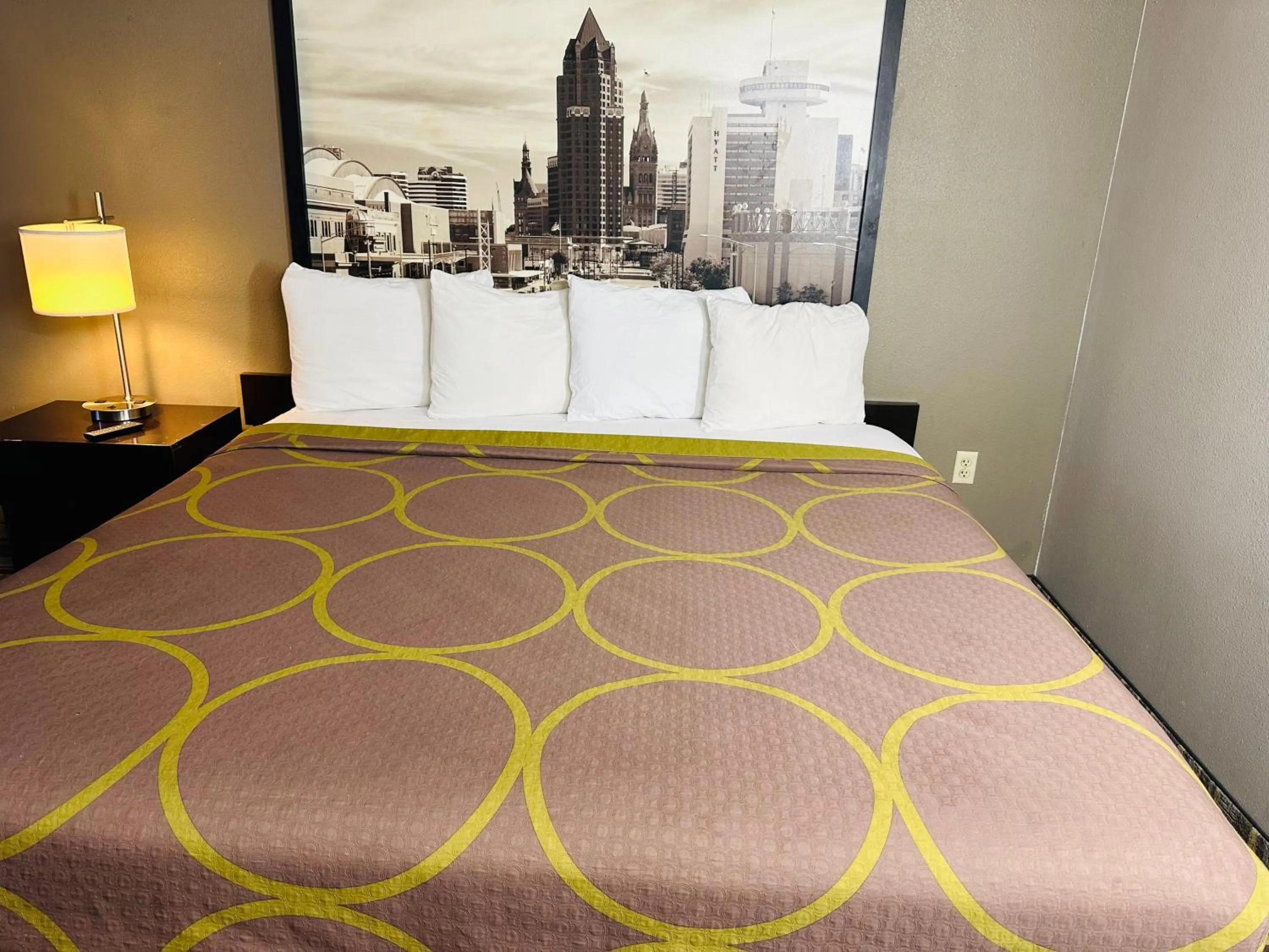 Bed in Delavan Inn and Suites