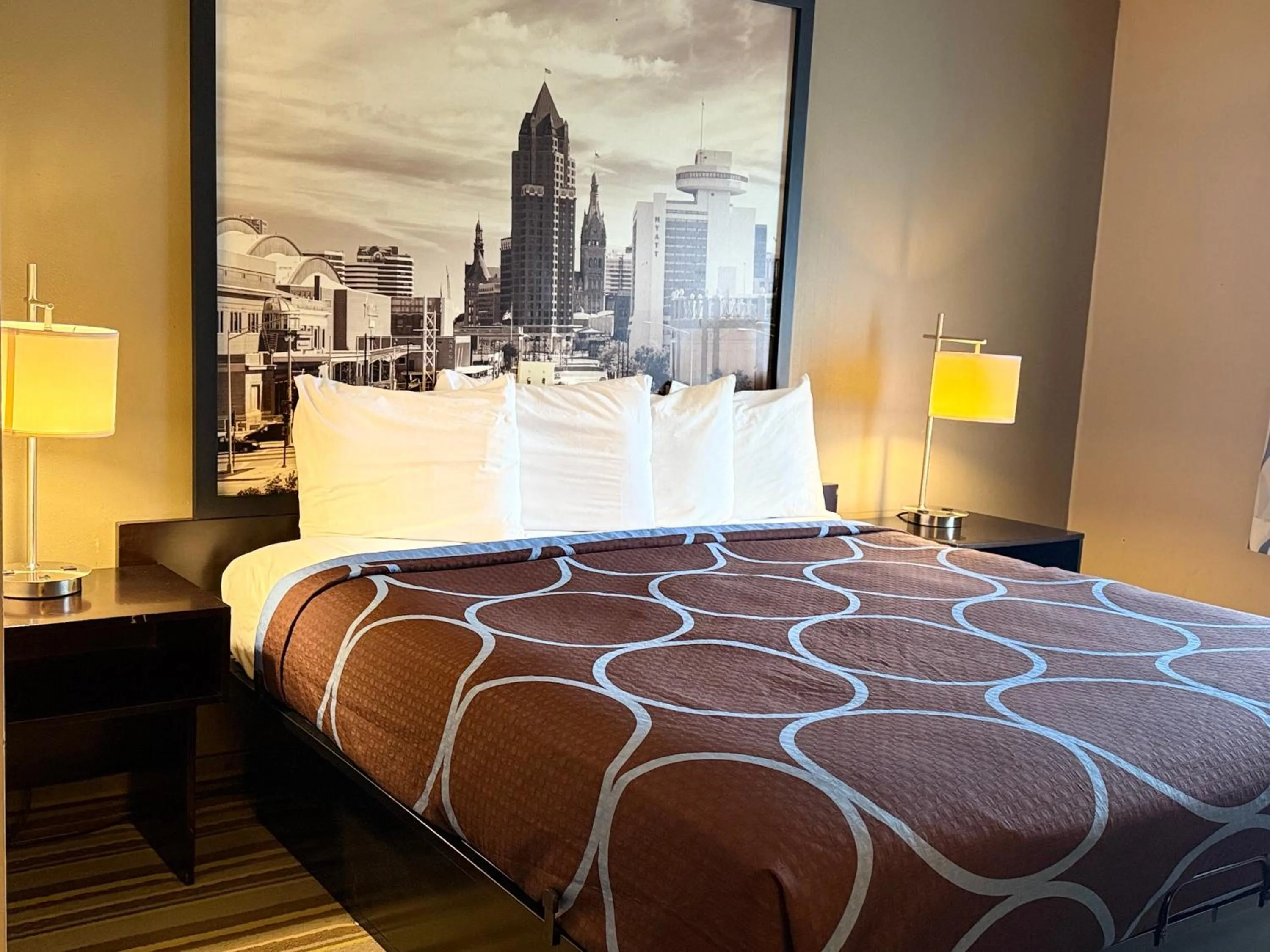 Bed in Delavan Inn and Suites