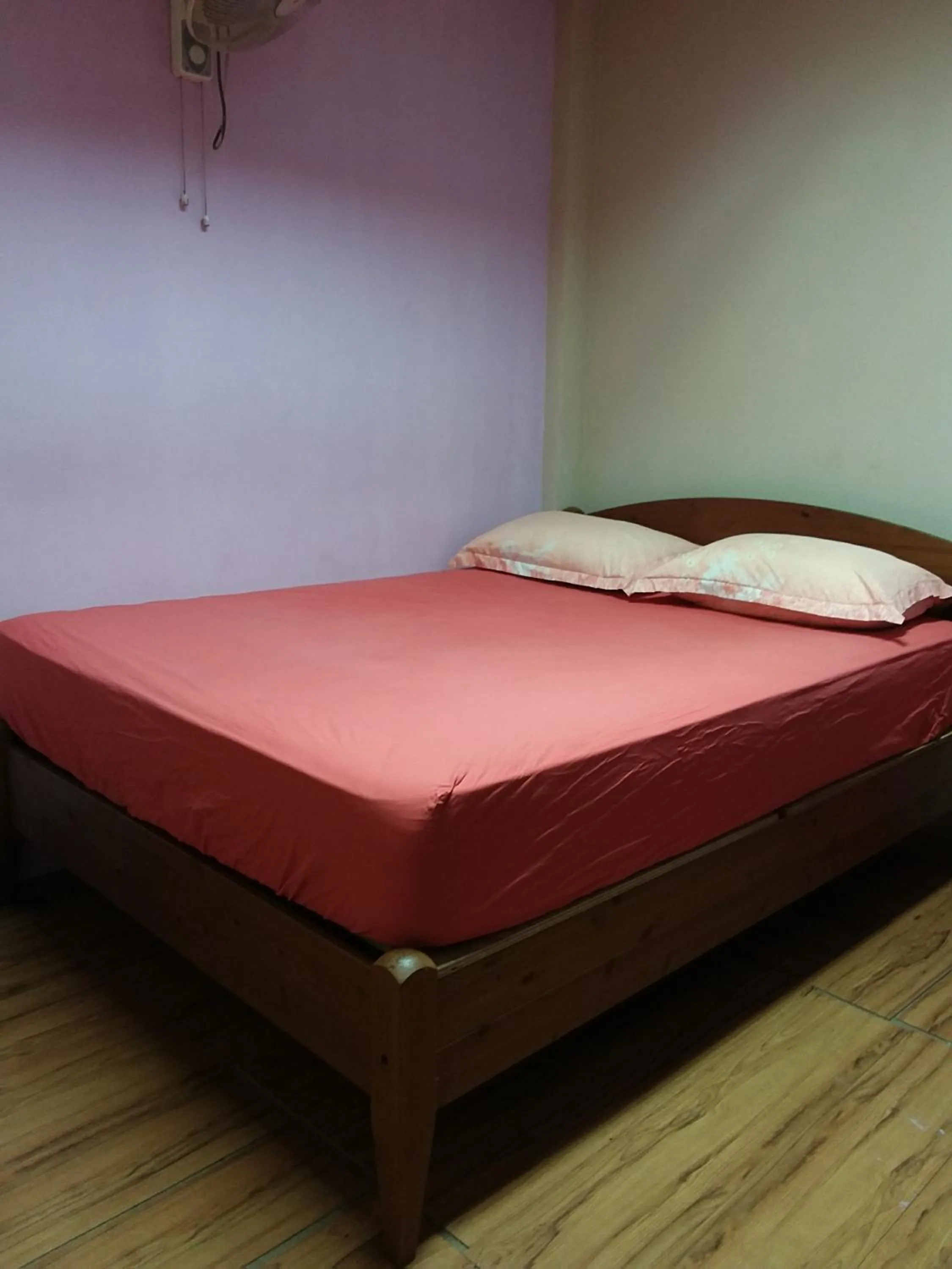 Bed in Oasis Guest House