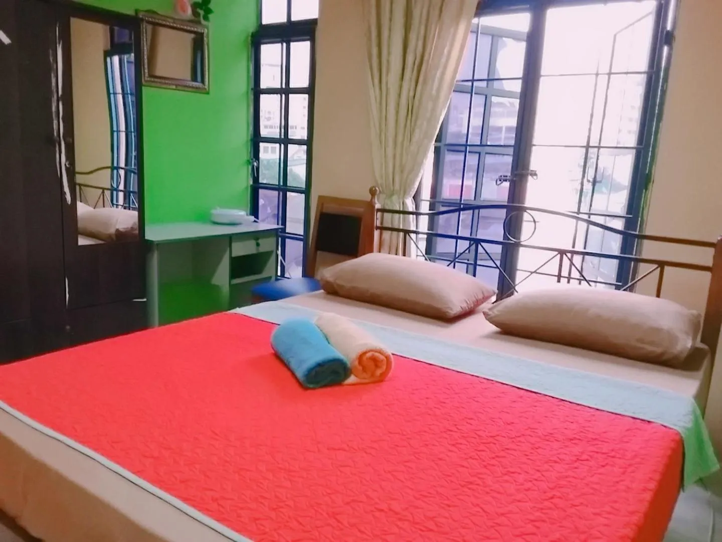 Bed in Oasis Guest House