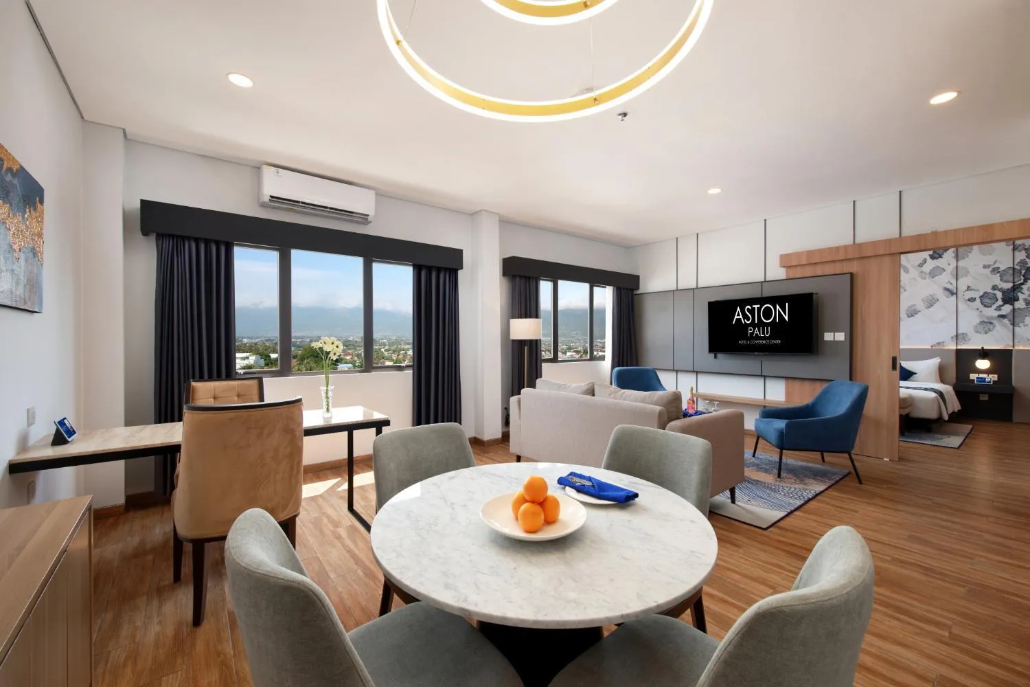 Living room in Aston Palu Hotel & Conference Center