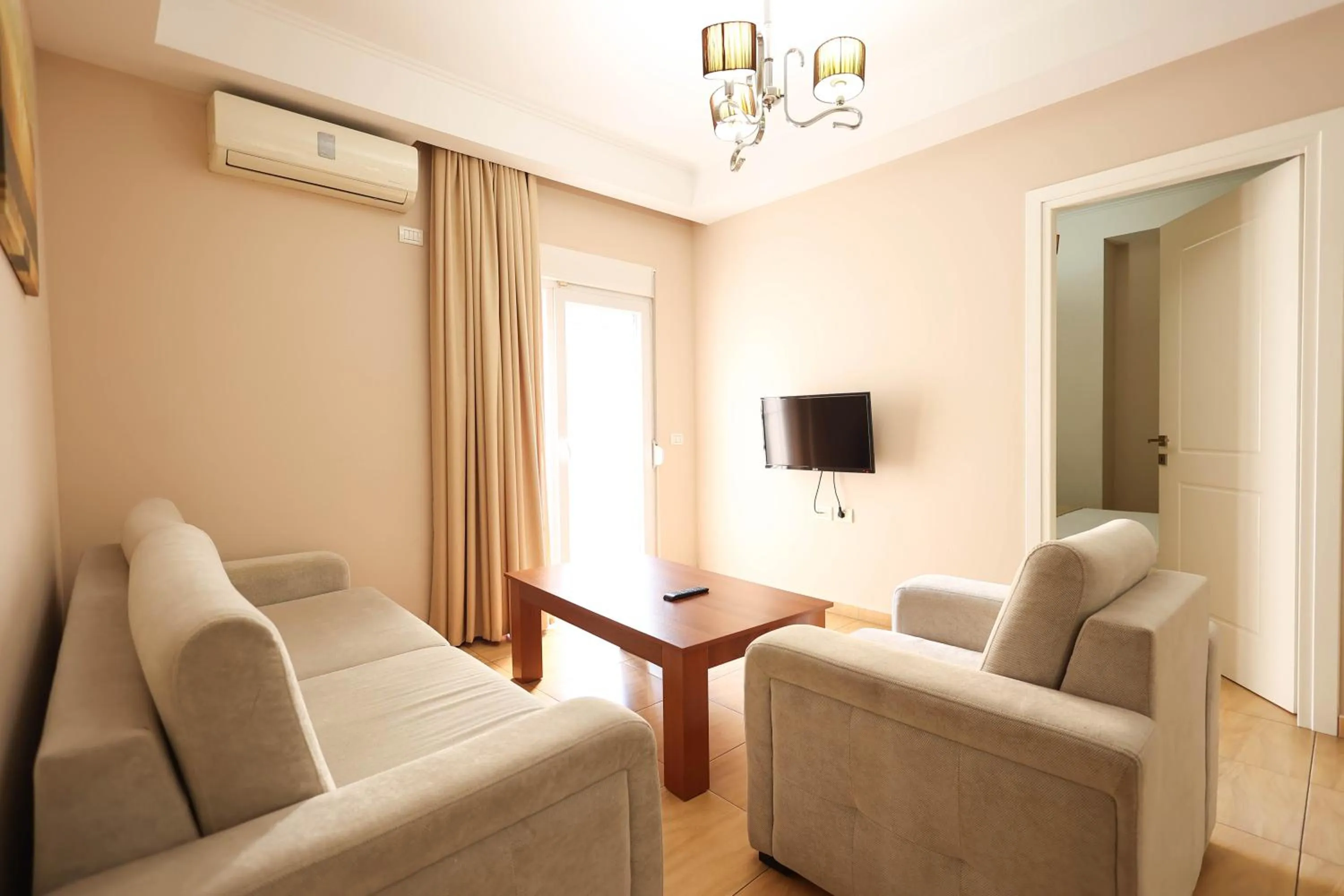 Communal lounge/ TV room in Apartments Flower Residence