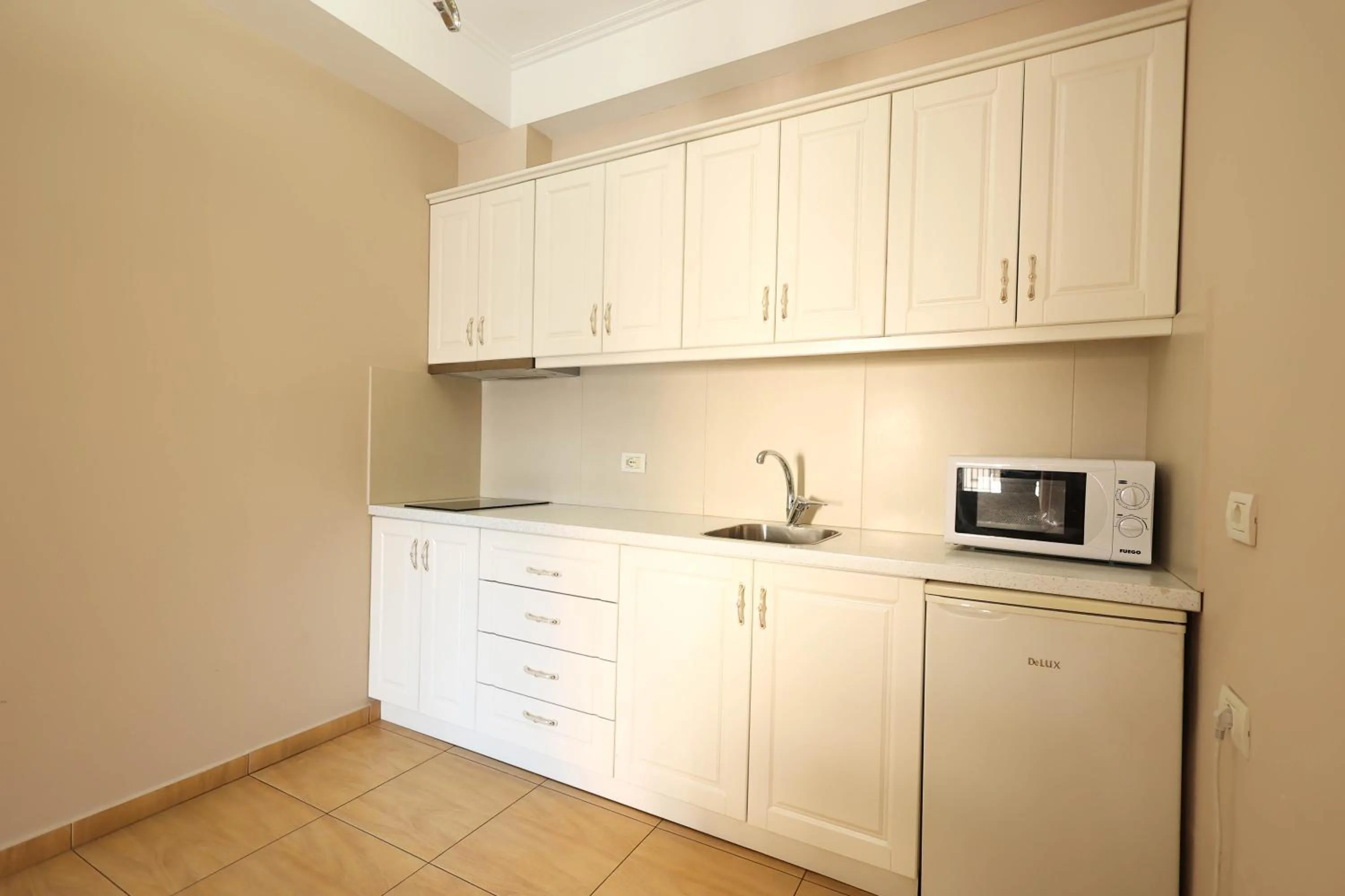 Kitchen or kitchenette in Apartments Flower Residence