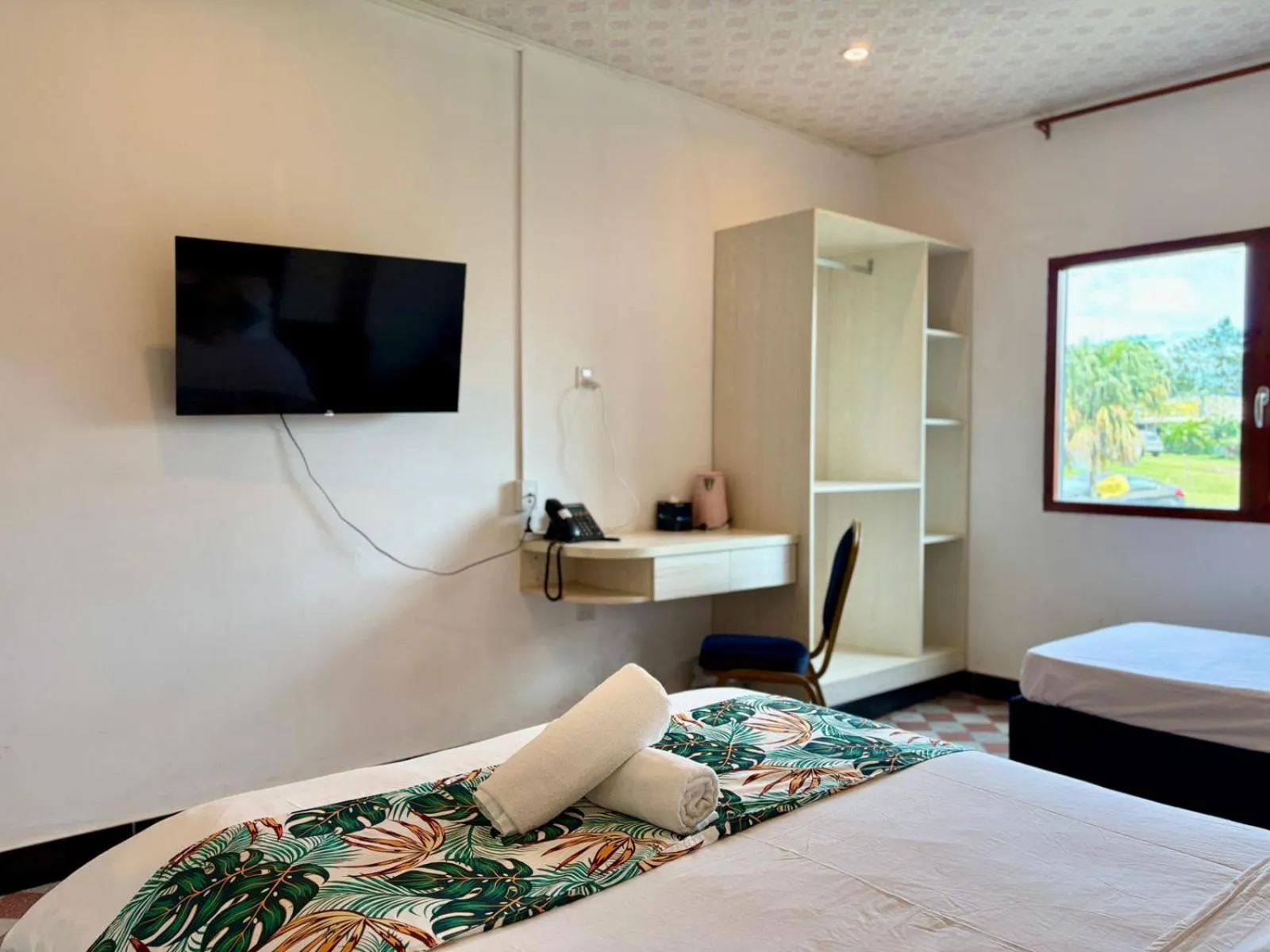 Bed in Crown Royale Hotel & Lounge