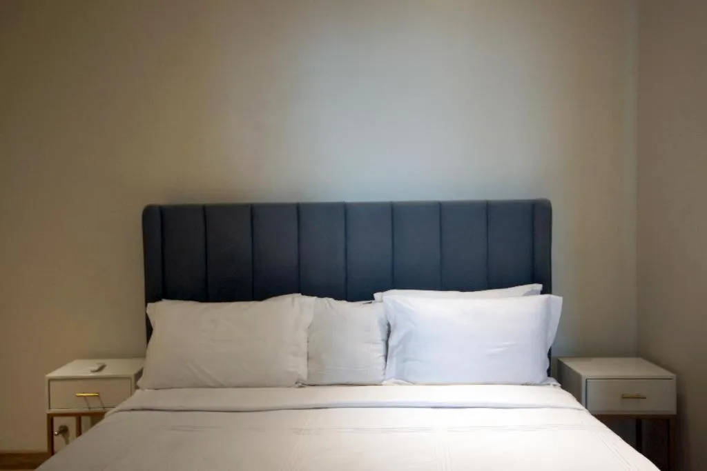 Bed in The Opus Luxury Residences