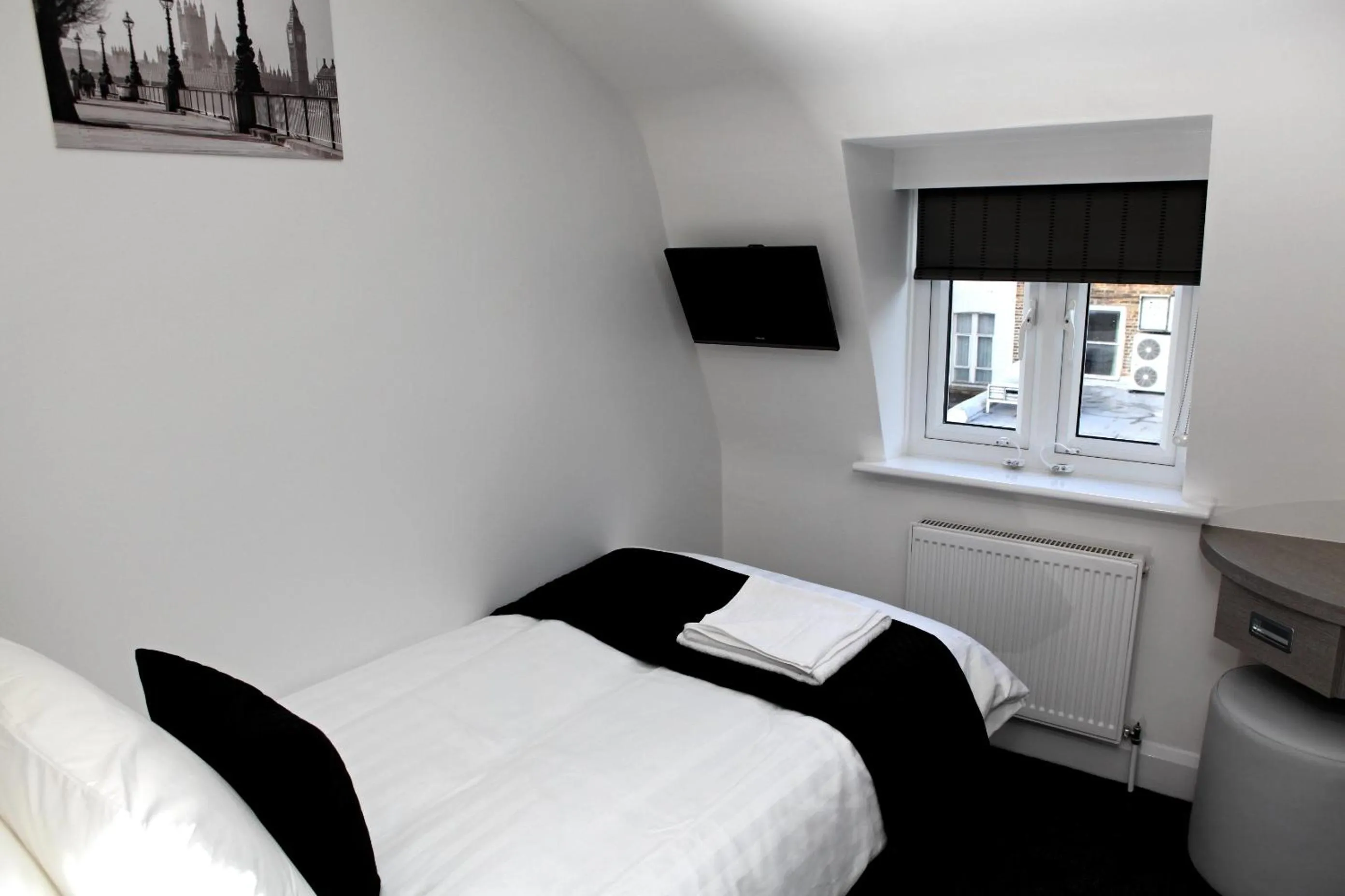 Photo of the whole room, Bed in The Omega Hotel