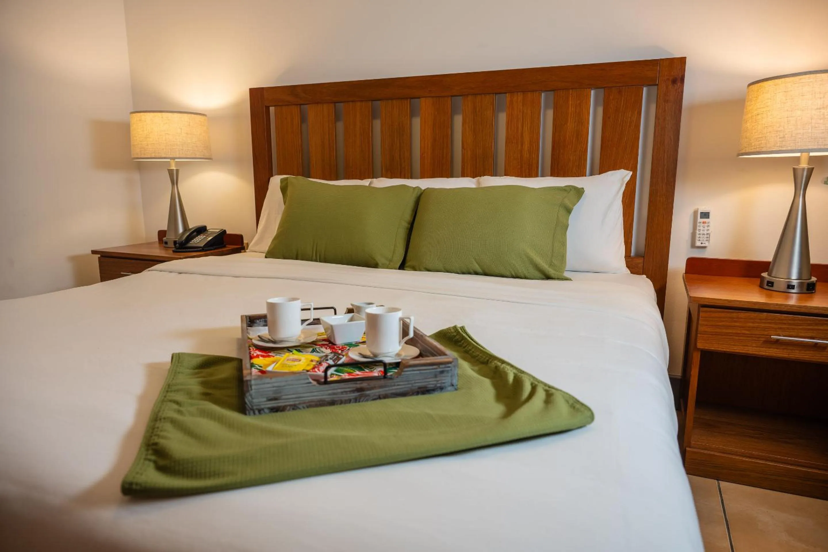 Bed in Grand Coastal Hotel