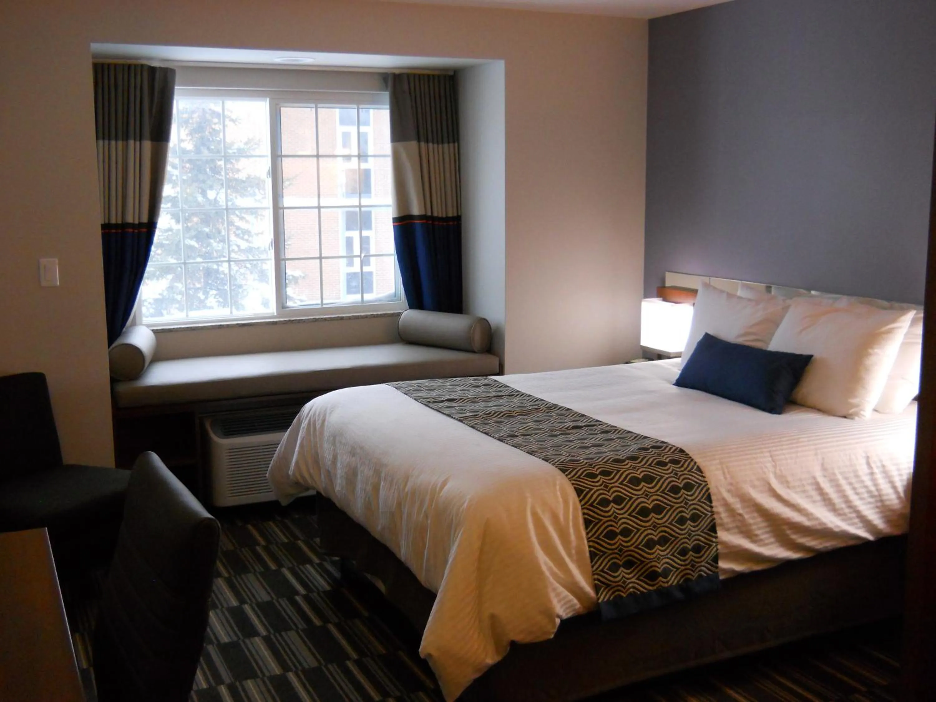 Bed in Microtel Inn & Suites Sault Ste. Marie