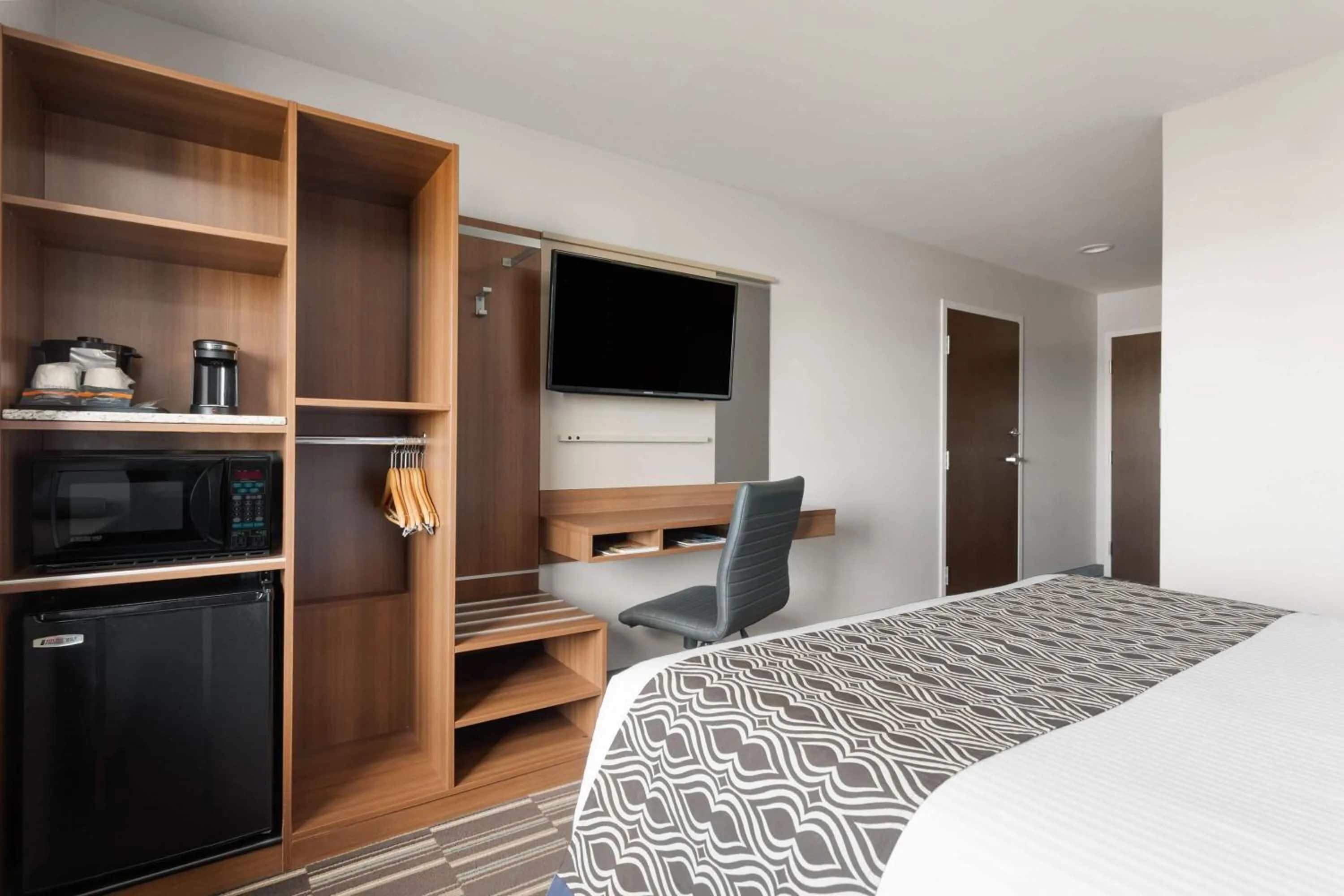 Photo of the whole room, Bed in Microtel Inn & Suites Sault Ste. Marie