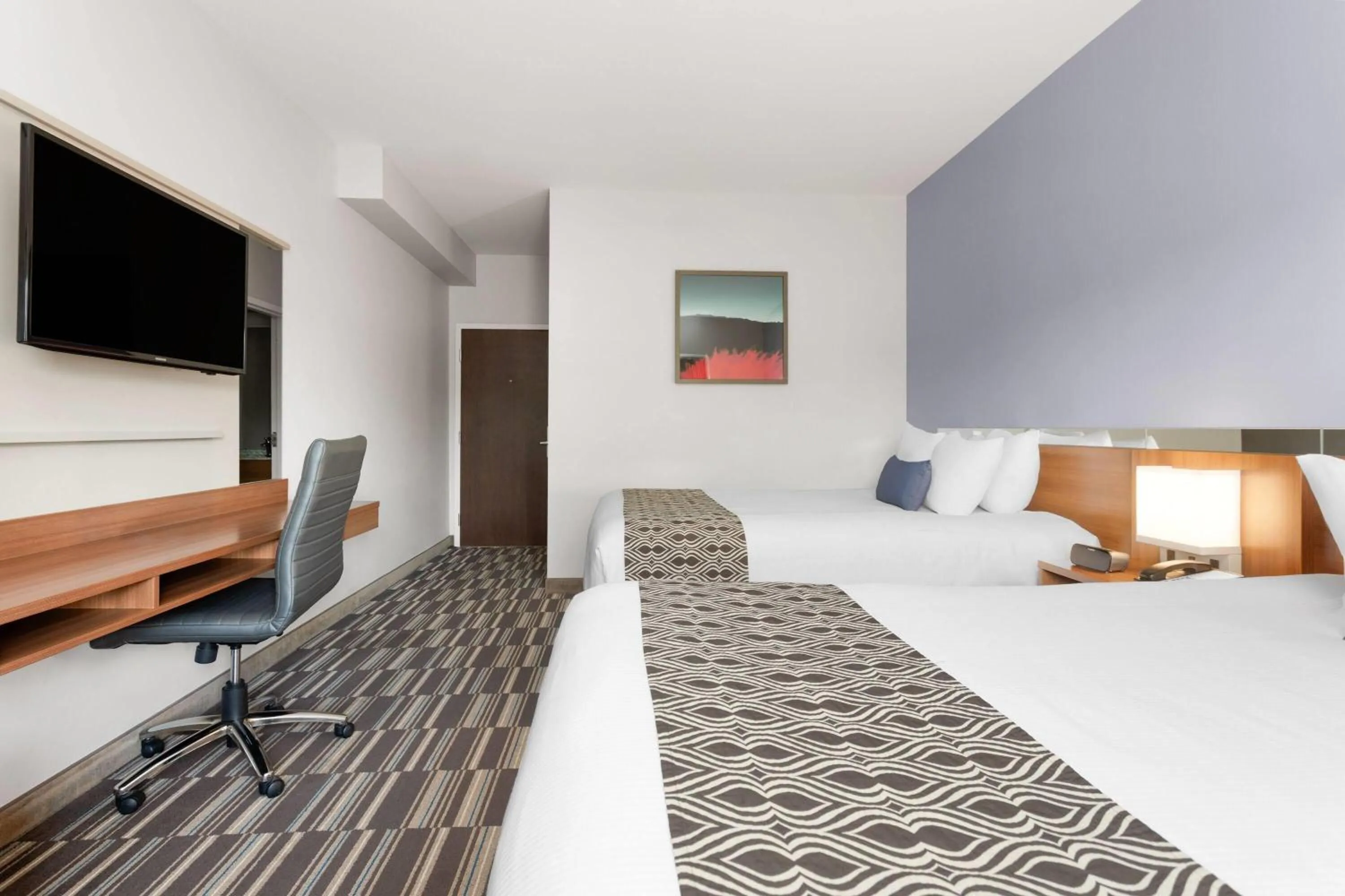 Photo of the whole room, Bed in Microtel Inn & Suites Sault Ste. Marie