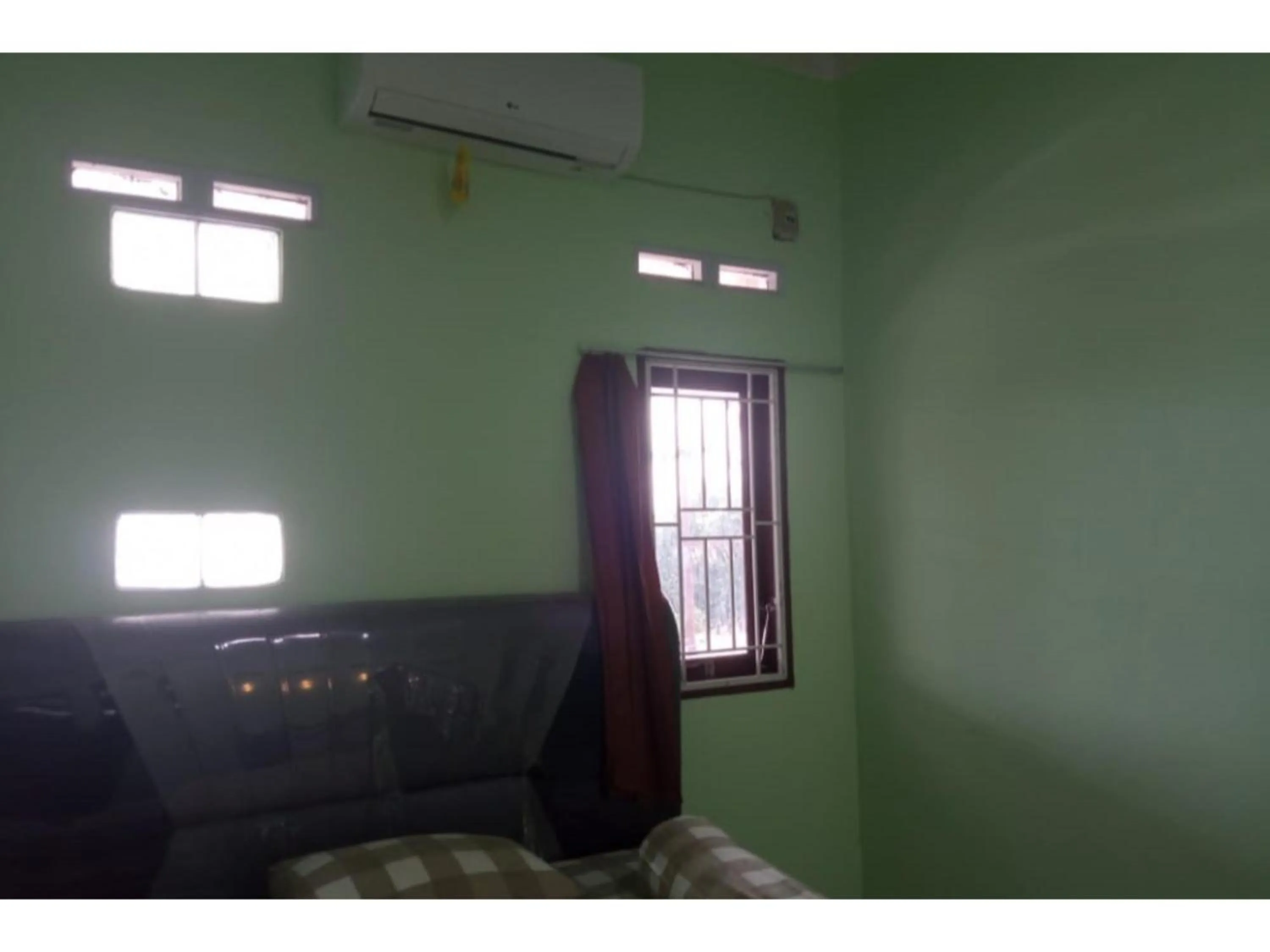 Bedroom in Hotel O White House SyariahNearOYO 93457 White House Syariah