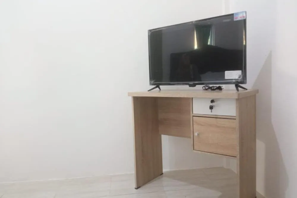 Bedroom in Hotel O White House SyariahNearOYO 93457 White House Syariah