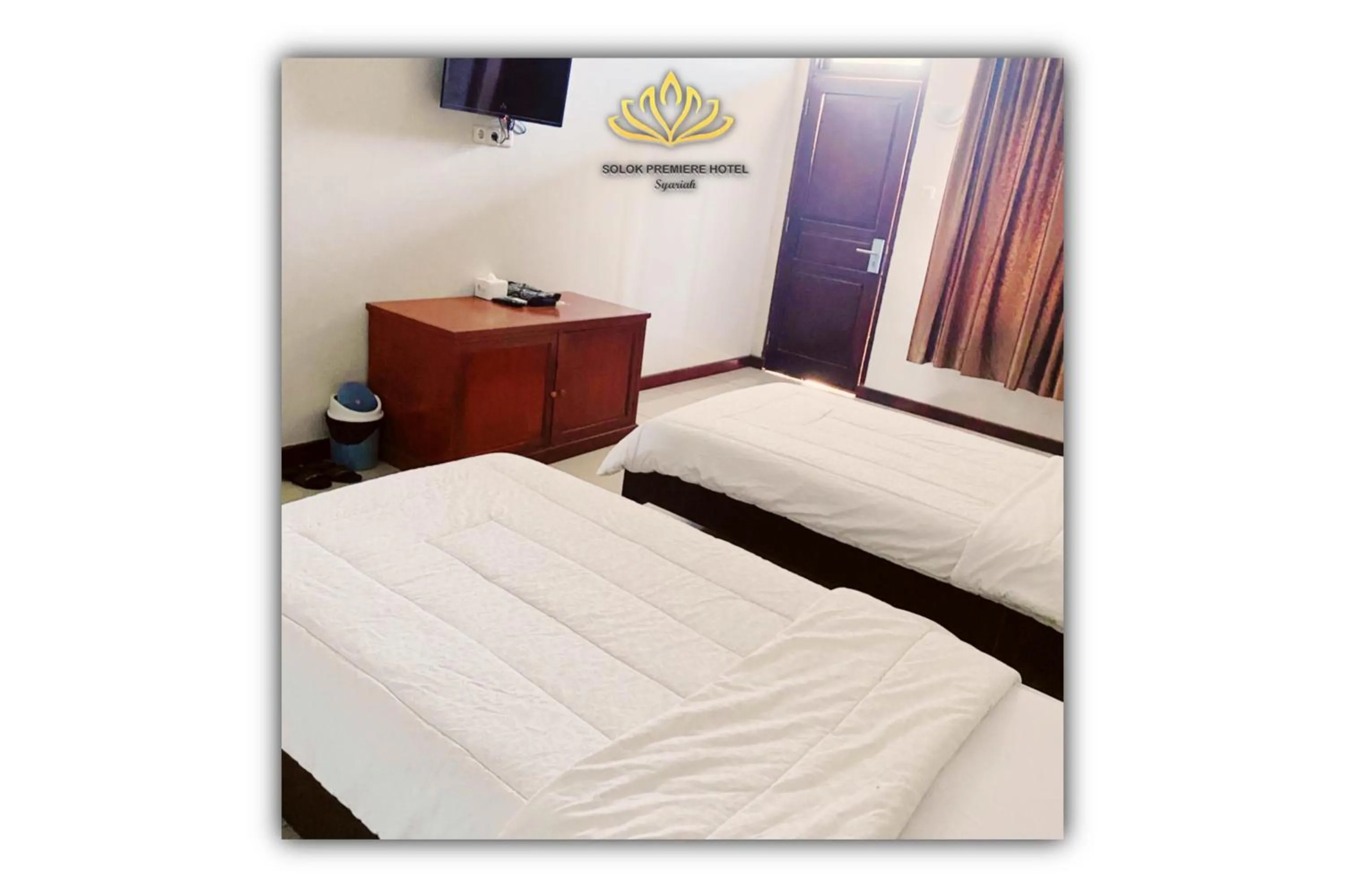 Bed in Solok Premier Hotel