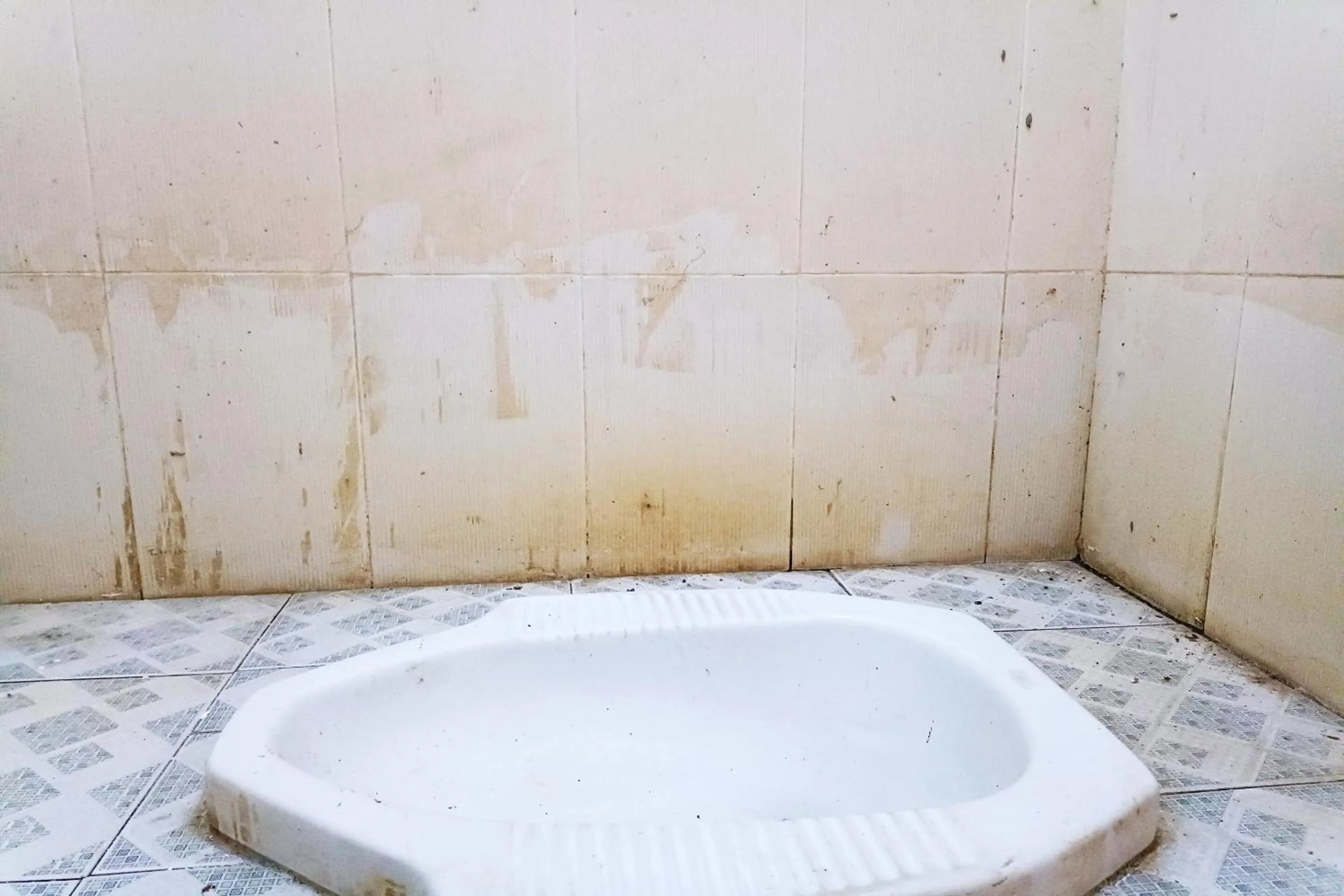 Bathroom in Hotel O Yuda Family Homestay Near Desa Wisata Hijau Bilebante