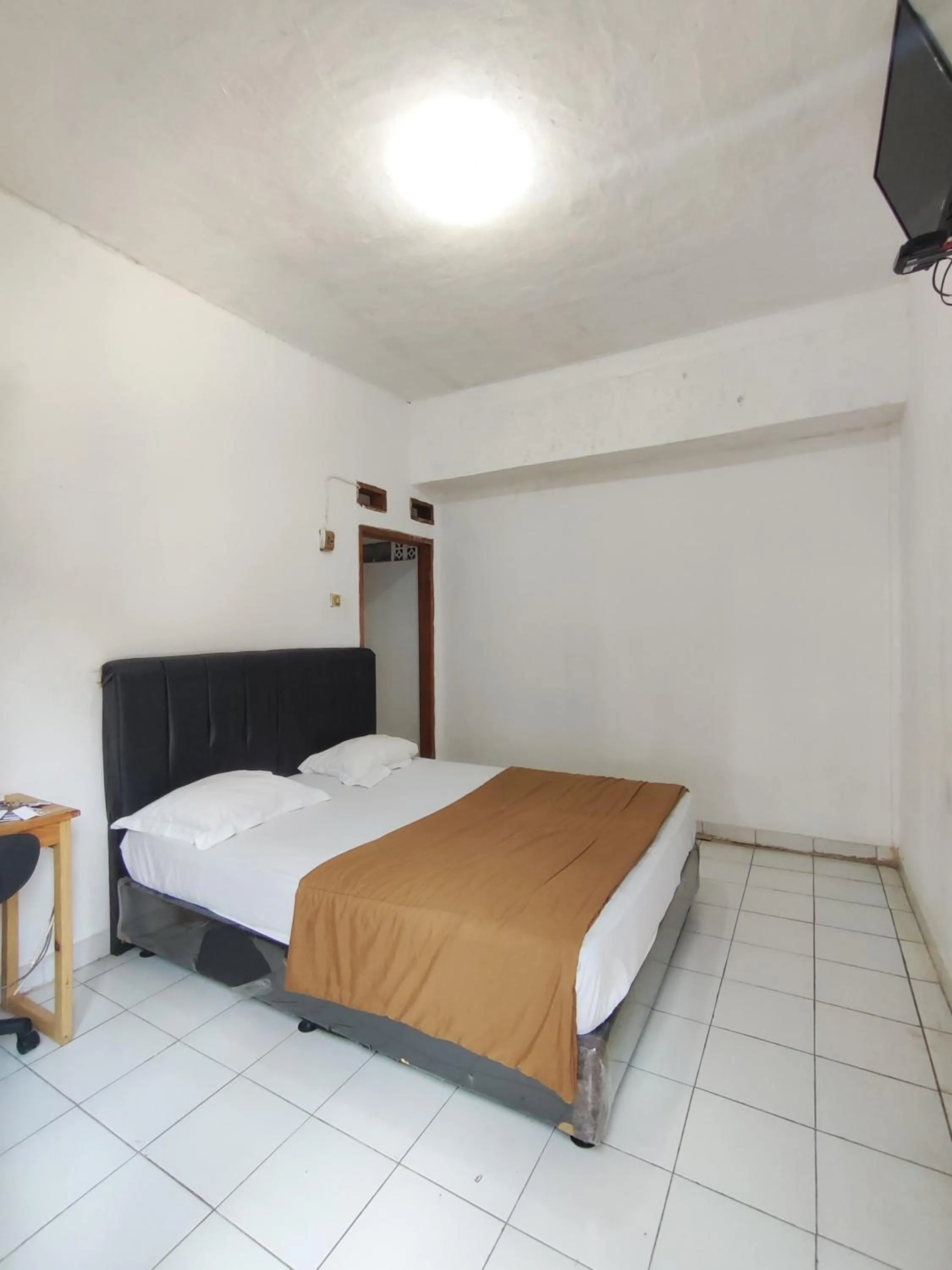 Bed in Penginapan Nurmega jaya